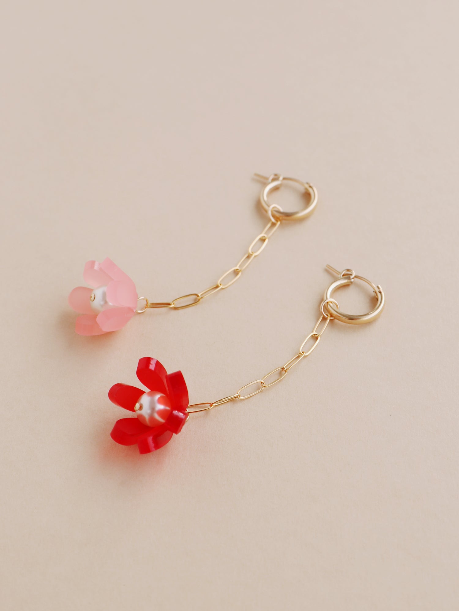 Red & pink sculptural tulip drop hoop earrings. Made from heat-formed acrylic with high quality glass pearls and 14k gold-filled findings. Handmade in the UK by Wolf & Moon