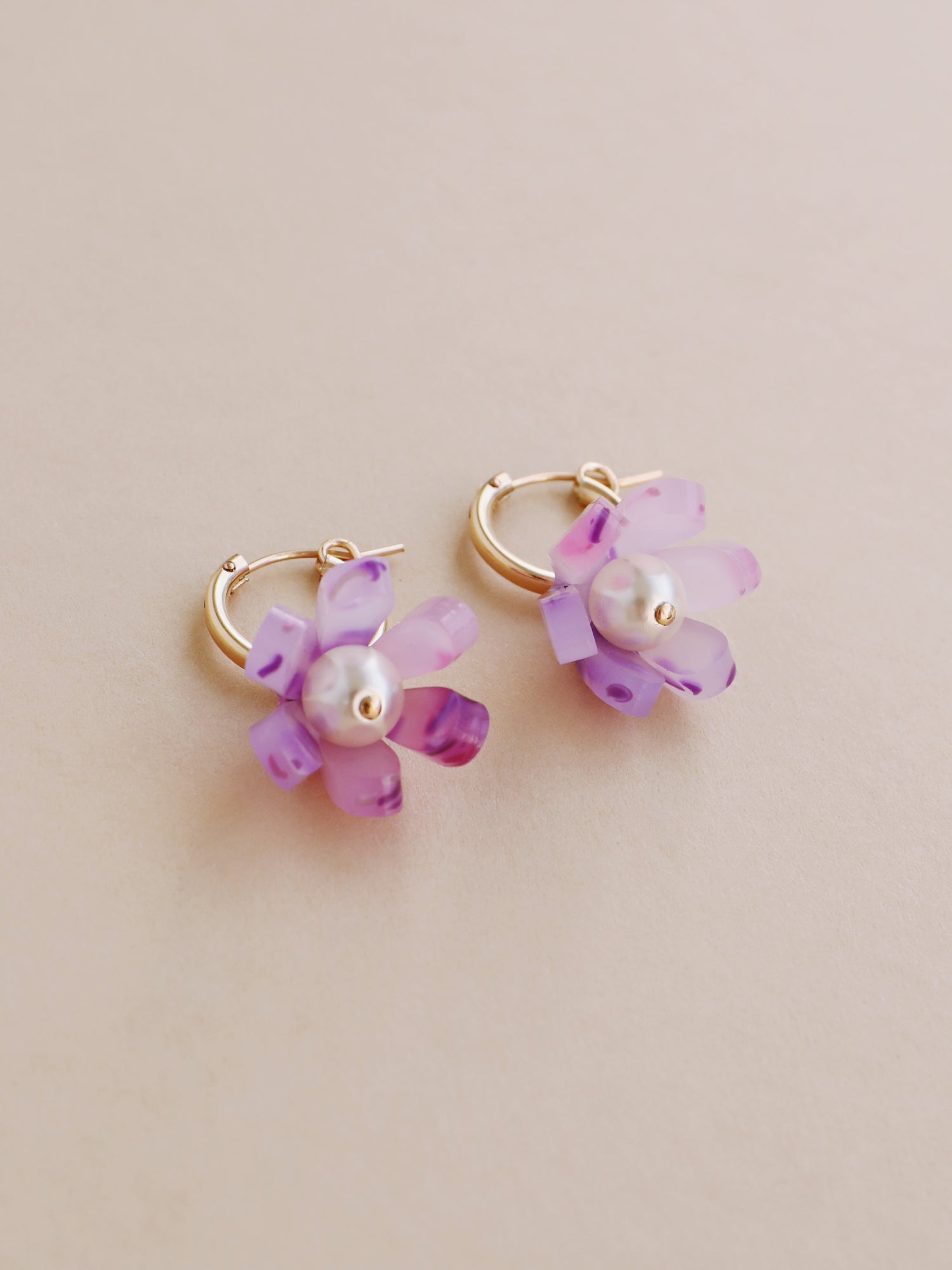 Purple, sculptural tulip hoop earrings. Made from heat-formed acrylic with high quality glass pearls and 14k gold-filled findings. Handmade in the UK by Wolf & Moon.