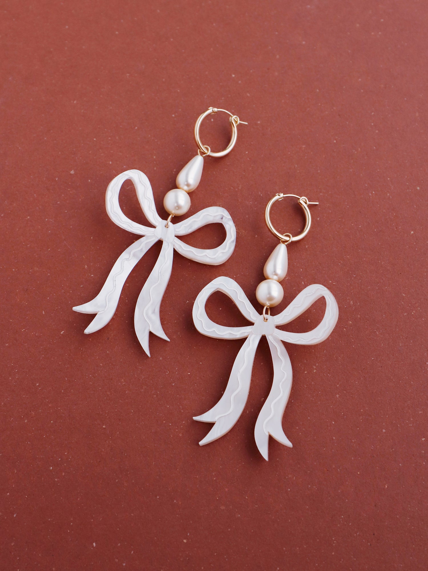 Bow Statement Hoops in Cream