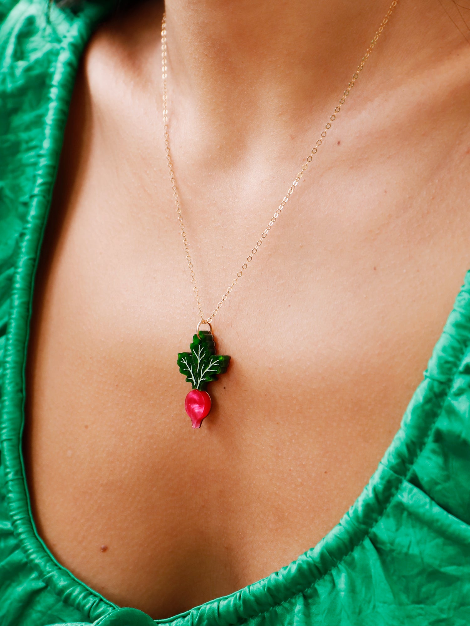Pink and green mini acrylic radish pendant necklace with optional gold-filled chain. Handmade in London by Wolf & Moon.