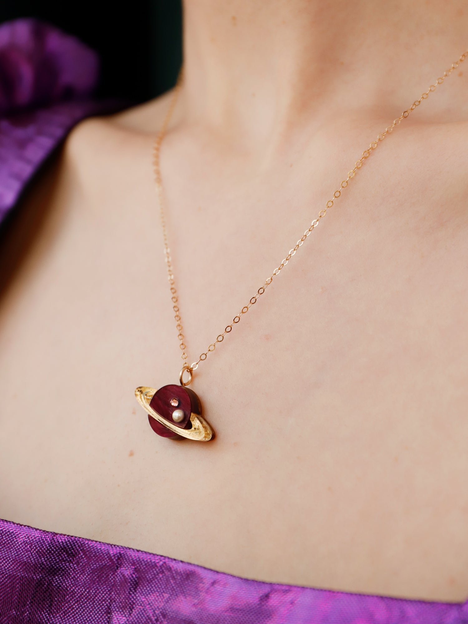 Saturn pendant necklace in pearlescent cherry acrylic, embellished with high quality glass pearls & crystals. Wear with our 14k gold-filled chain. Handmade in London by Wolf & Moon.