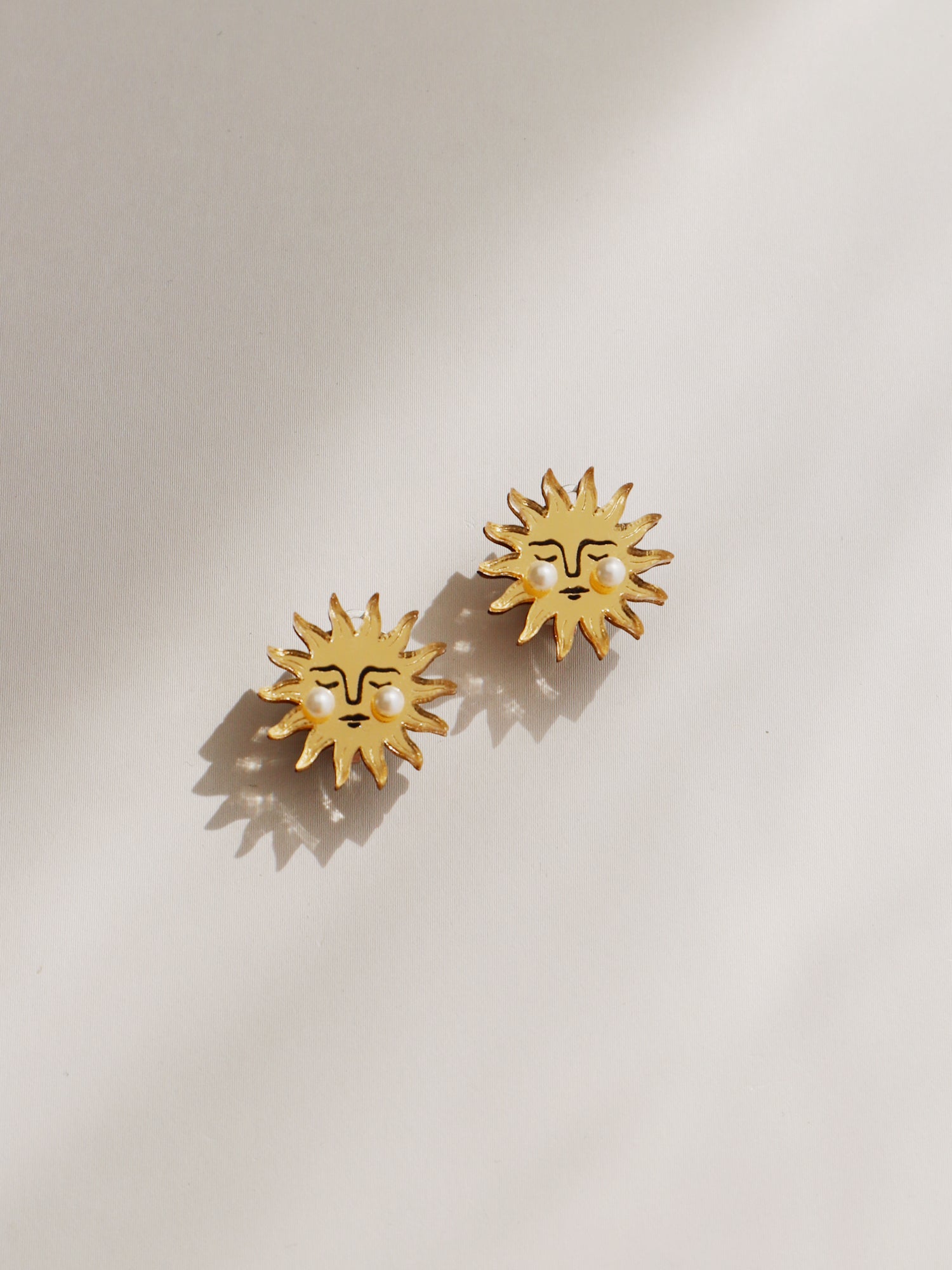 Sun Studs. Earrings made with laser cut acrylic, Czech glass pearls and hand inked details. Handmade in the UK by Wolf & Moon.