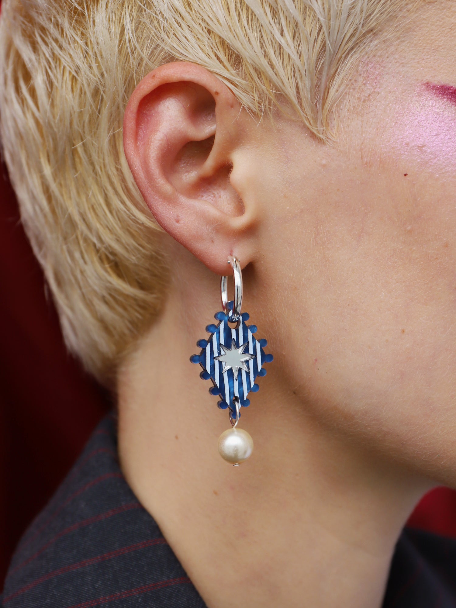 Cirque Hoops in Sapphire worn by model, showcasing handmade details and unique design. Handmade in UK by Wolf & Moon.