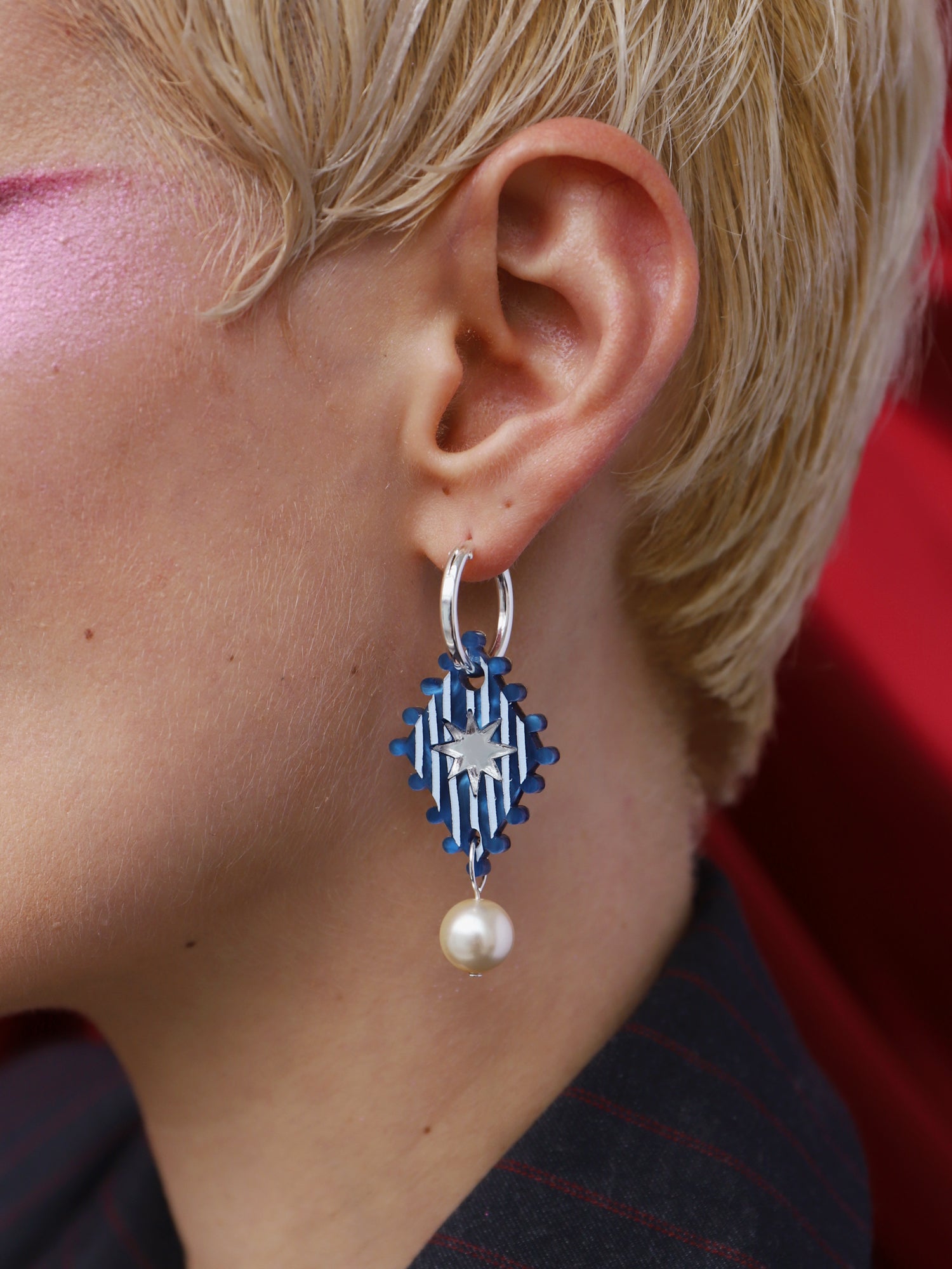 Cirque Hoops in Sapphire worn by a model, showcasing the handmade design and glass pearl details.
