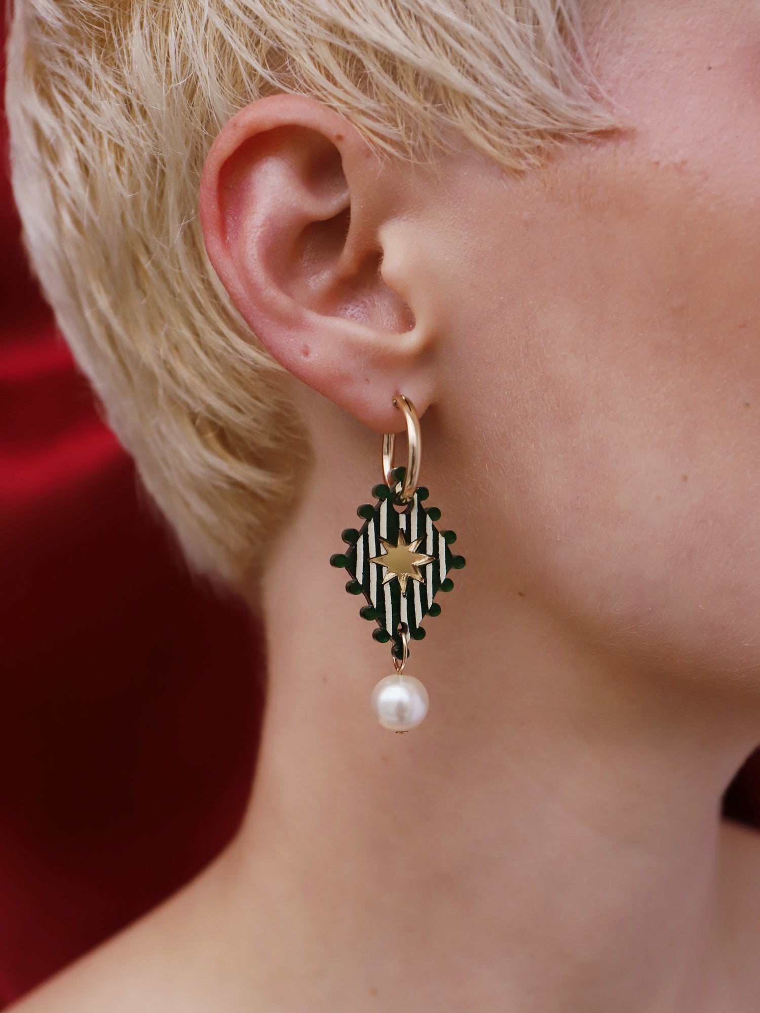 Cirque Hoops in Jade worn by a model, showcasing hand-inked design and glass pearl detail, Handmade in UK by Wolf & Moon.