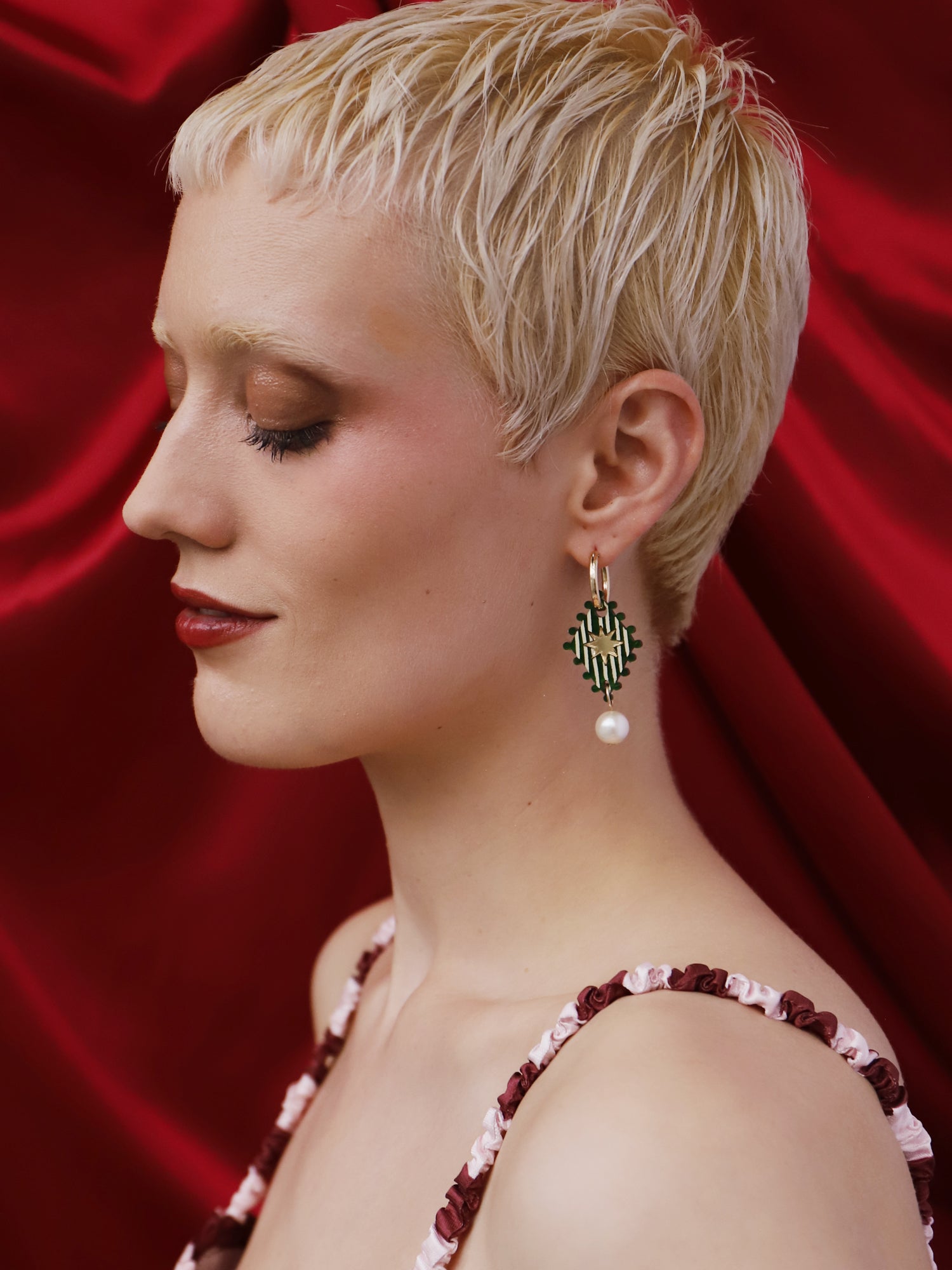 Model showcasing Cirque Hoops in Jade earrings made by Wolf & Moon, featuring intricate hand-inked details and glass pearl accents.