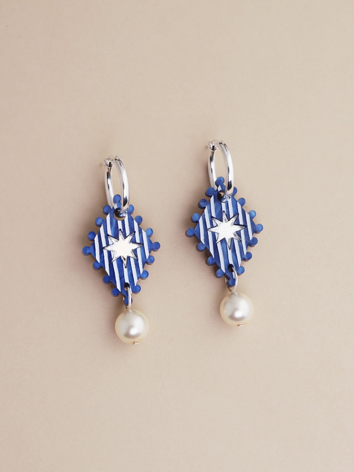 Cirque Hoops in Sapphire with pearl details, handmade in UK by Wolf & Moon, featuring unique, intricate design.