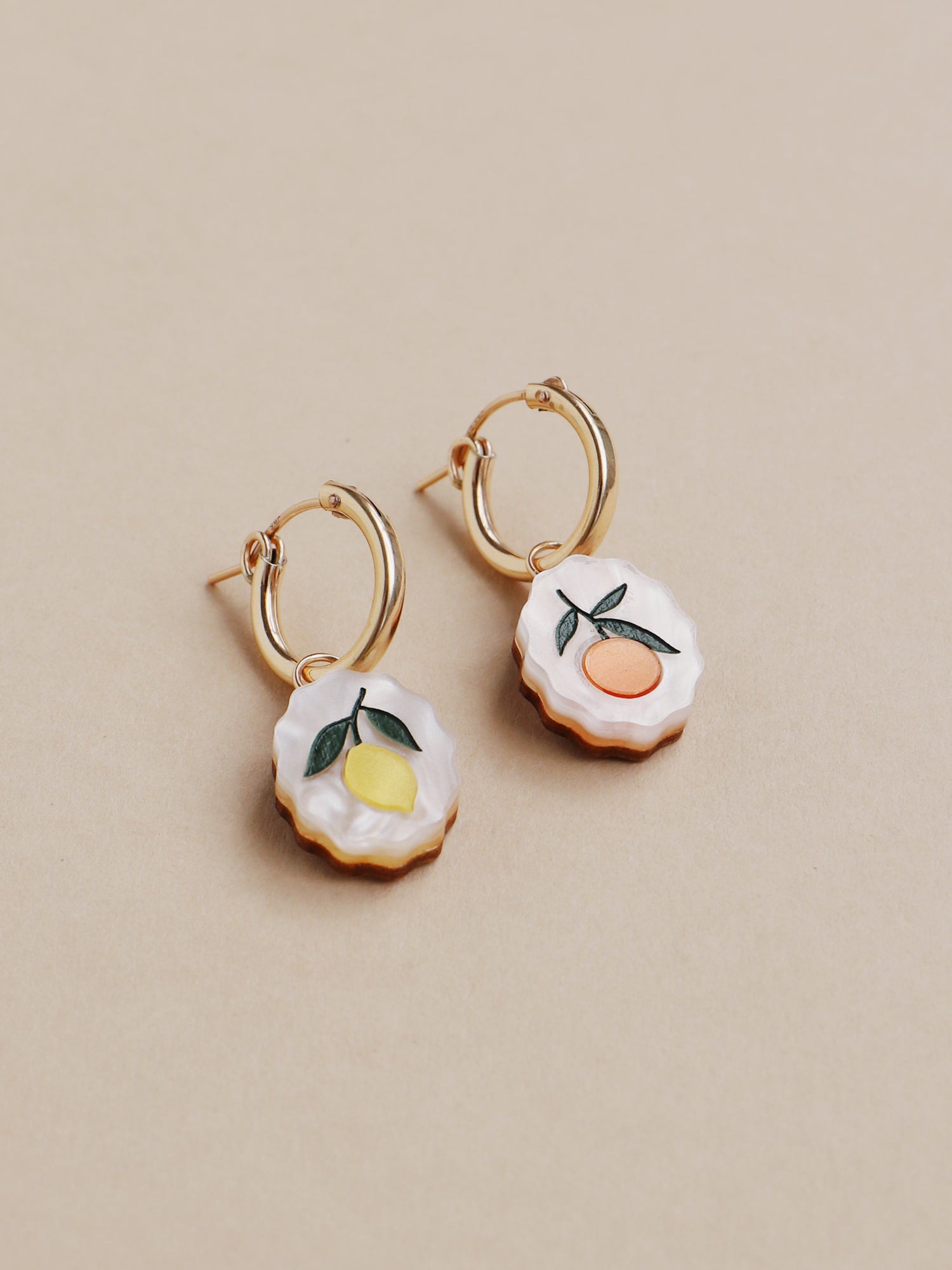 Lemon and orange charm hoop earrings. Made from acrylic and 14k gold-filled hoops & findings.  Handmade in the UK by Wolf & Moon.