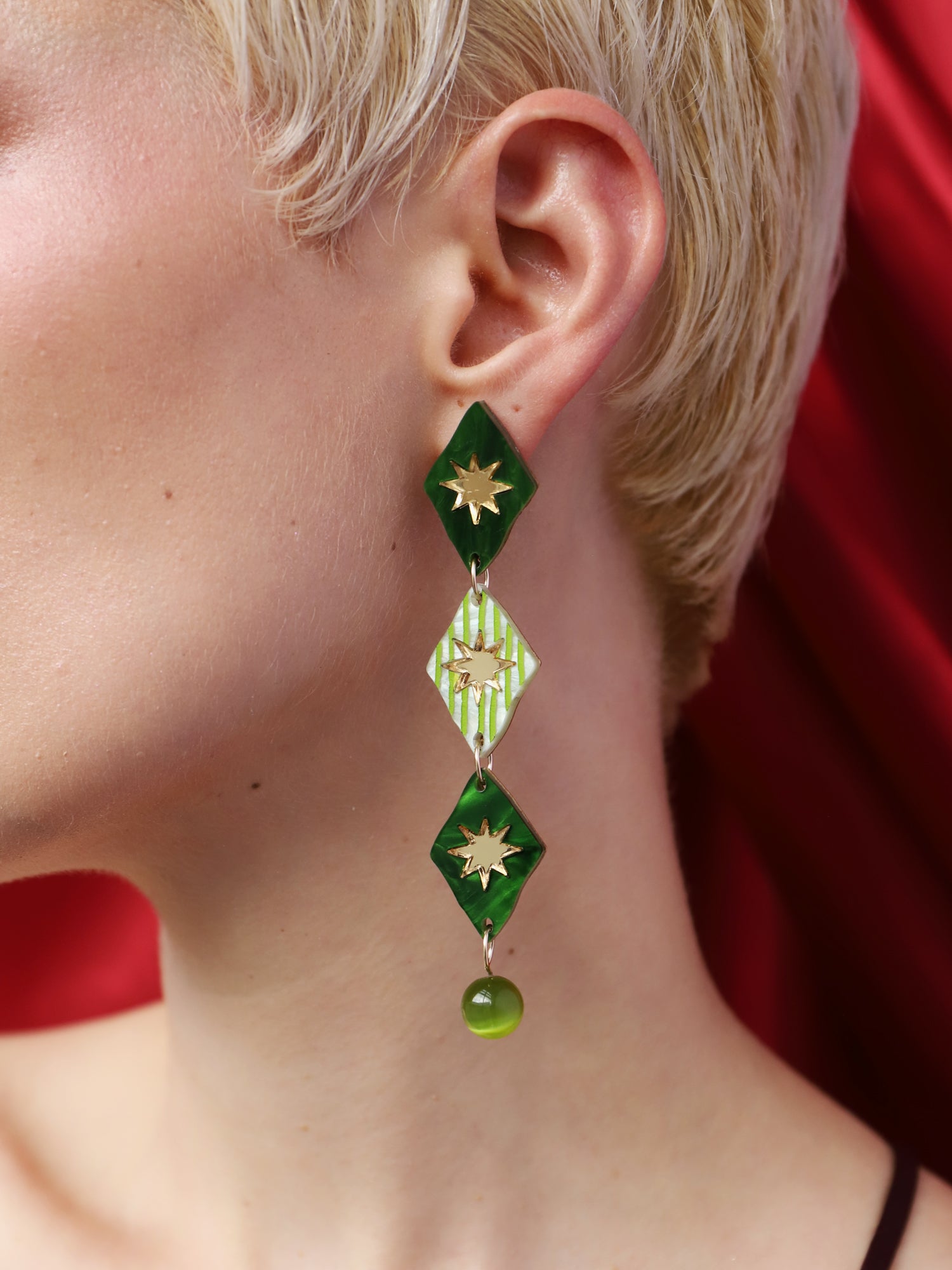 Harley Statement Earrings in Jade worn by model, showcasing unique design with hand-inked acrylic and glass bead details.