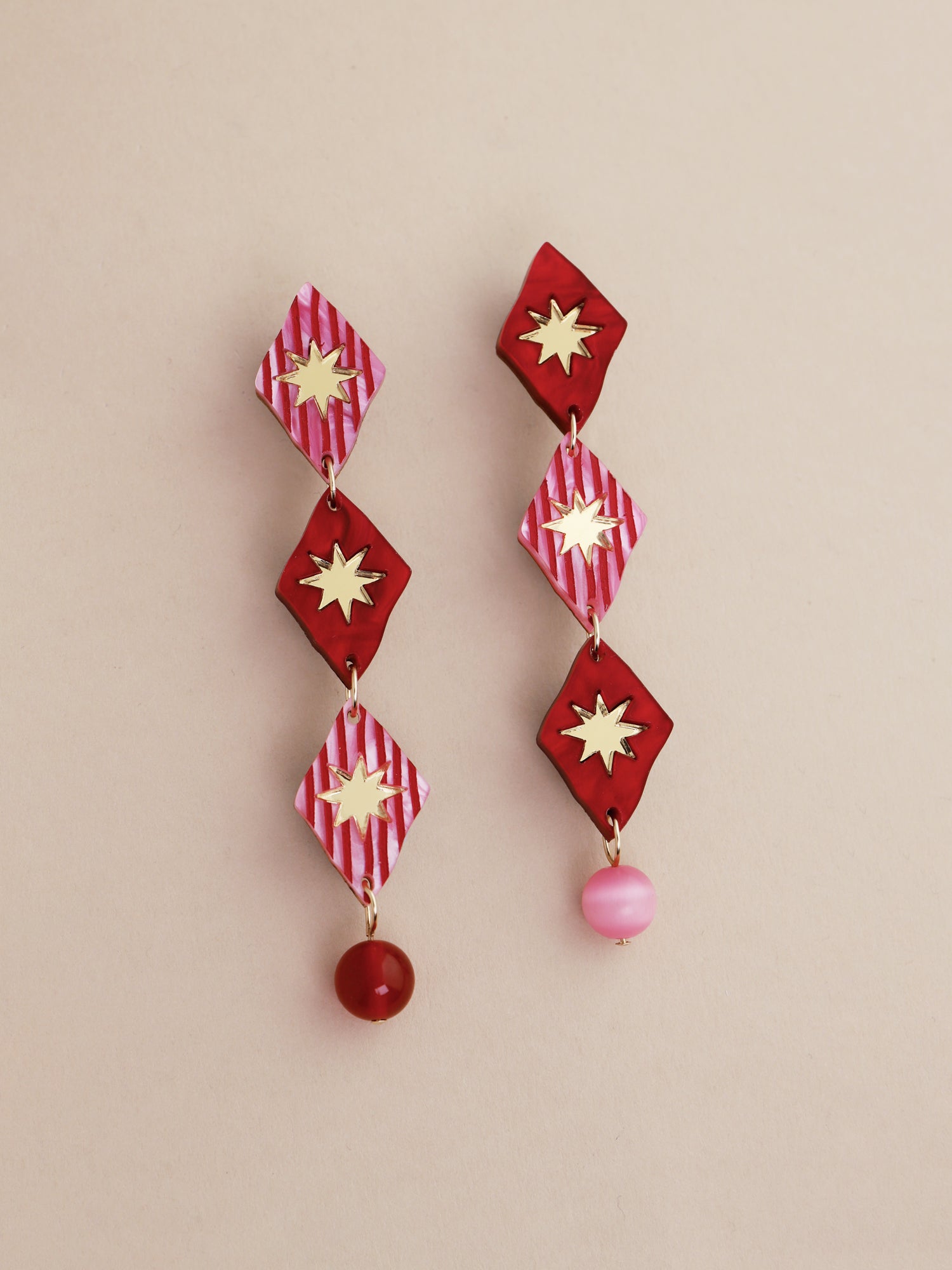 Harley Statement Earrings in Rose featuring hand-inked acrylic, bead details, and a unique design.