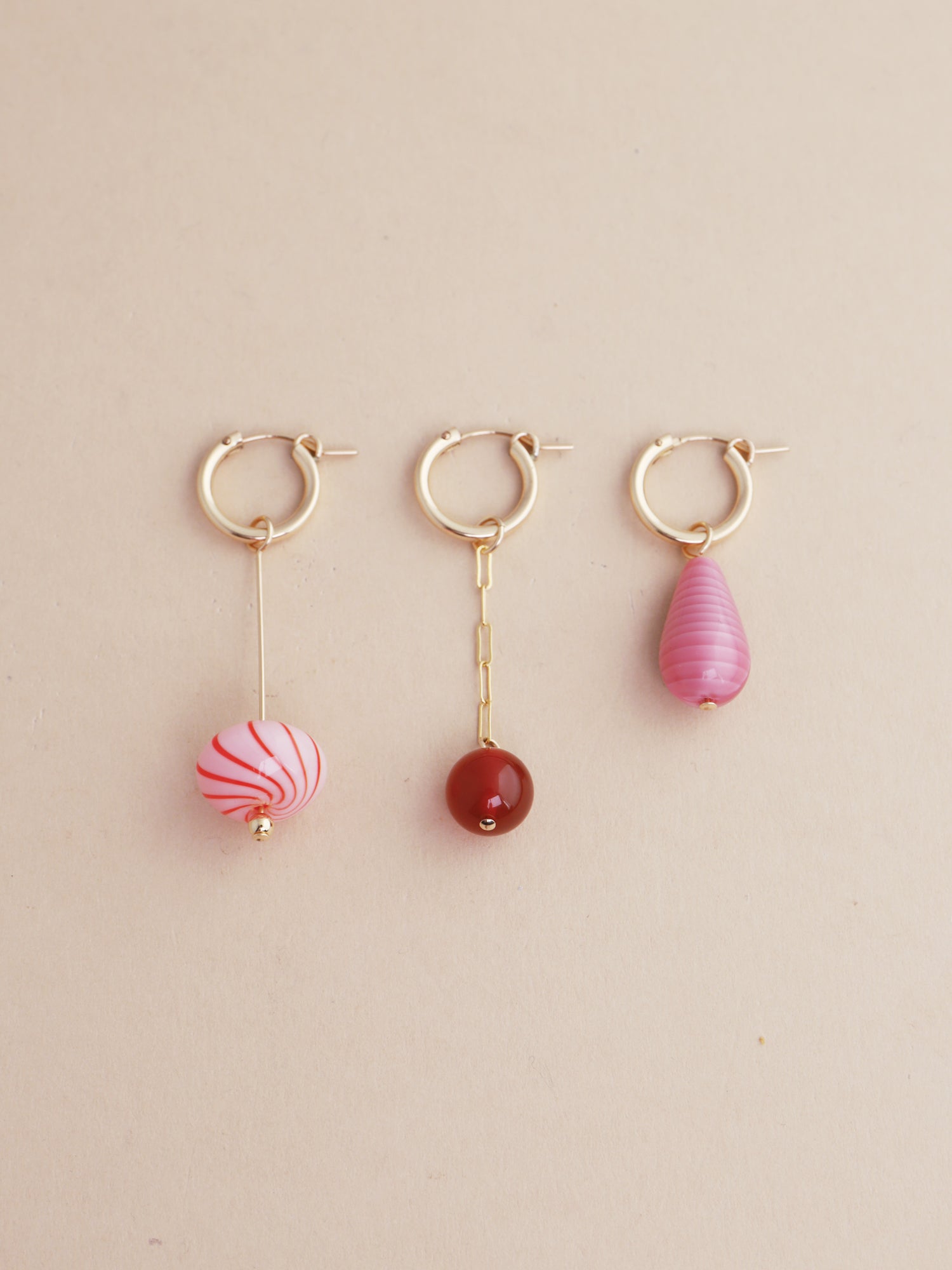 Kaleido Charm Hoops Set in Rose featuring three unique colorful charms with gold-filled hoops.