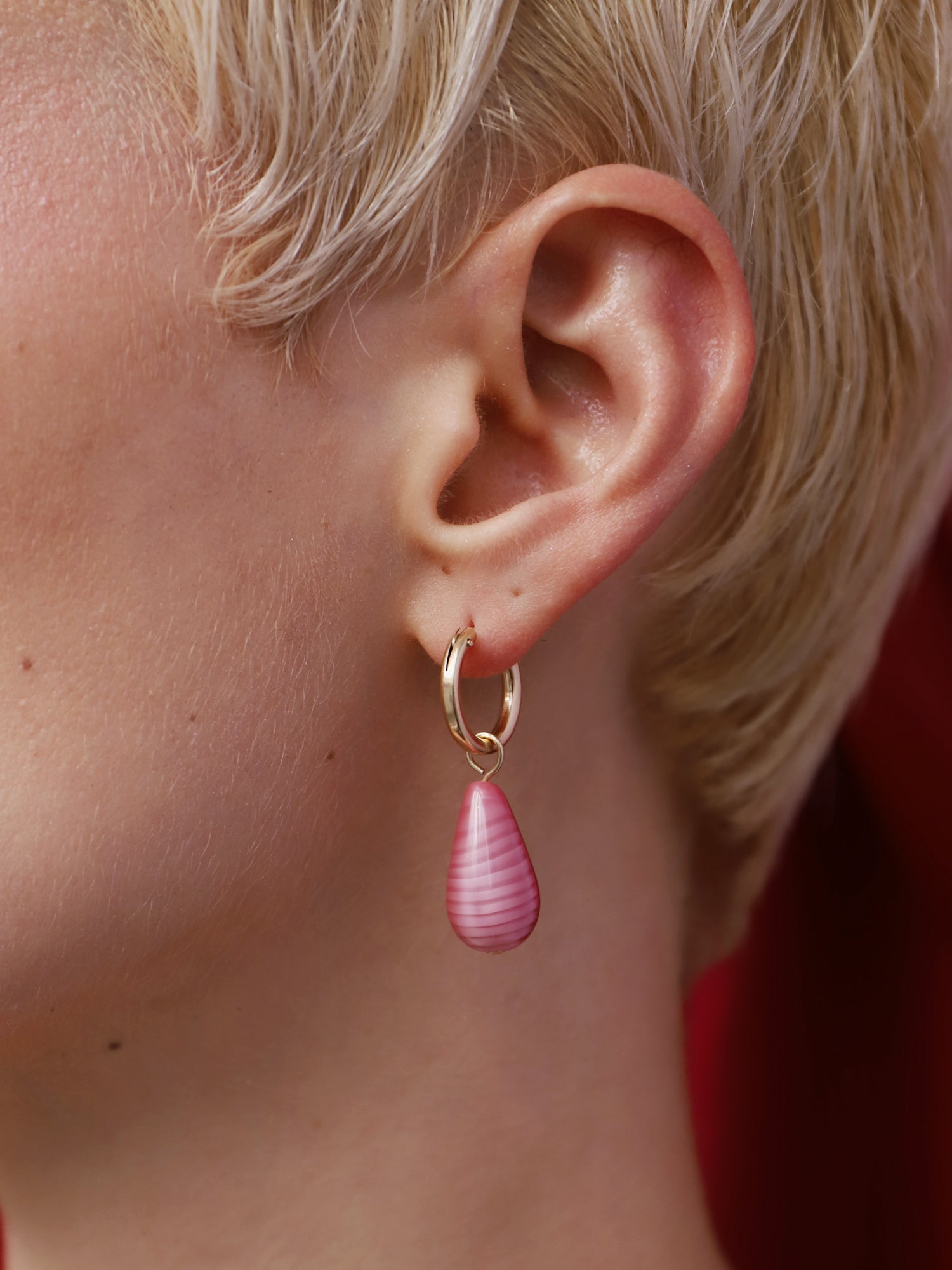 Kaleido Charm Hoops Set in Rose worn by a model showcasing hand-inked acrylic charm detail.
