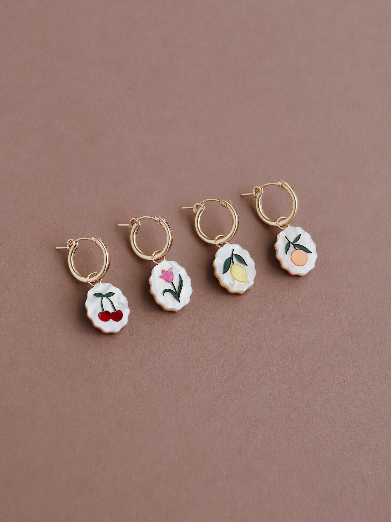 Lemon, cherry, tulip & orange mix n’ match charm hoop earrings. Made from acrylic and 14k gold-filled hoops & findings. Handmade in the UK by Wolf & Moon.