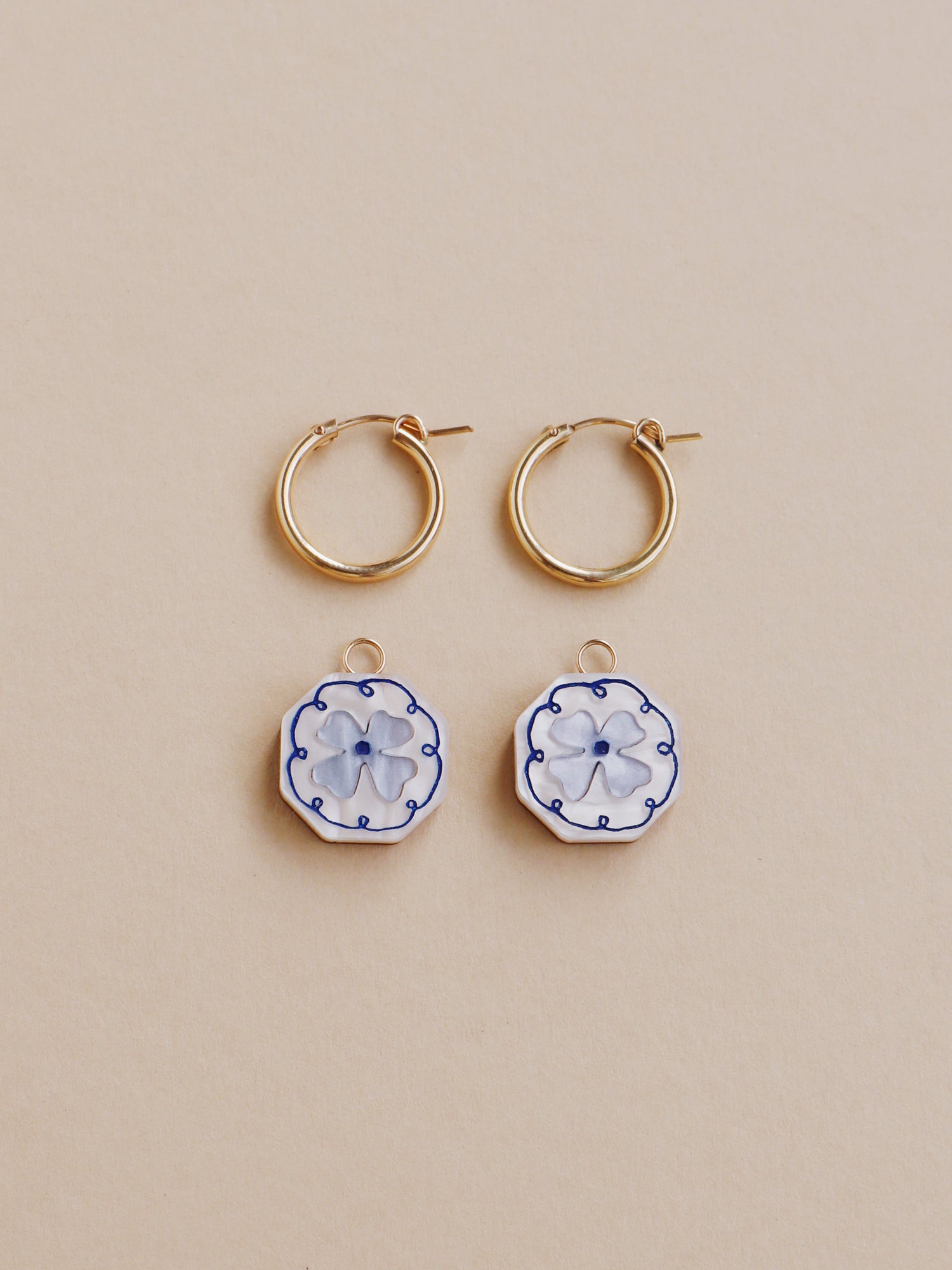 Blue and white poppy charm hoop earrings. Made from acrylic and 14k gold-filled hoops & findings.  Handmade in the UK by Wolf & Moon.