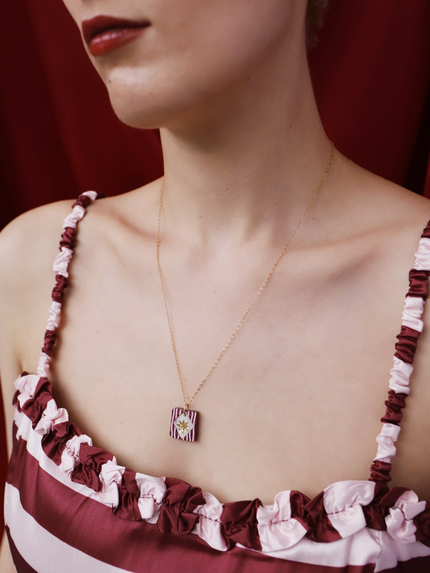 Model wearing Stella Necklace in Cherry, highlighting its unique design and gold-filled chain.