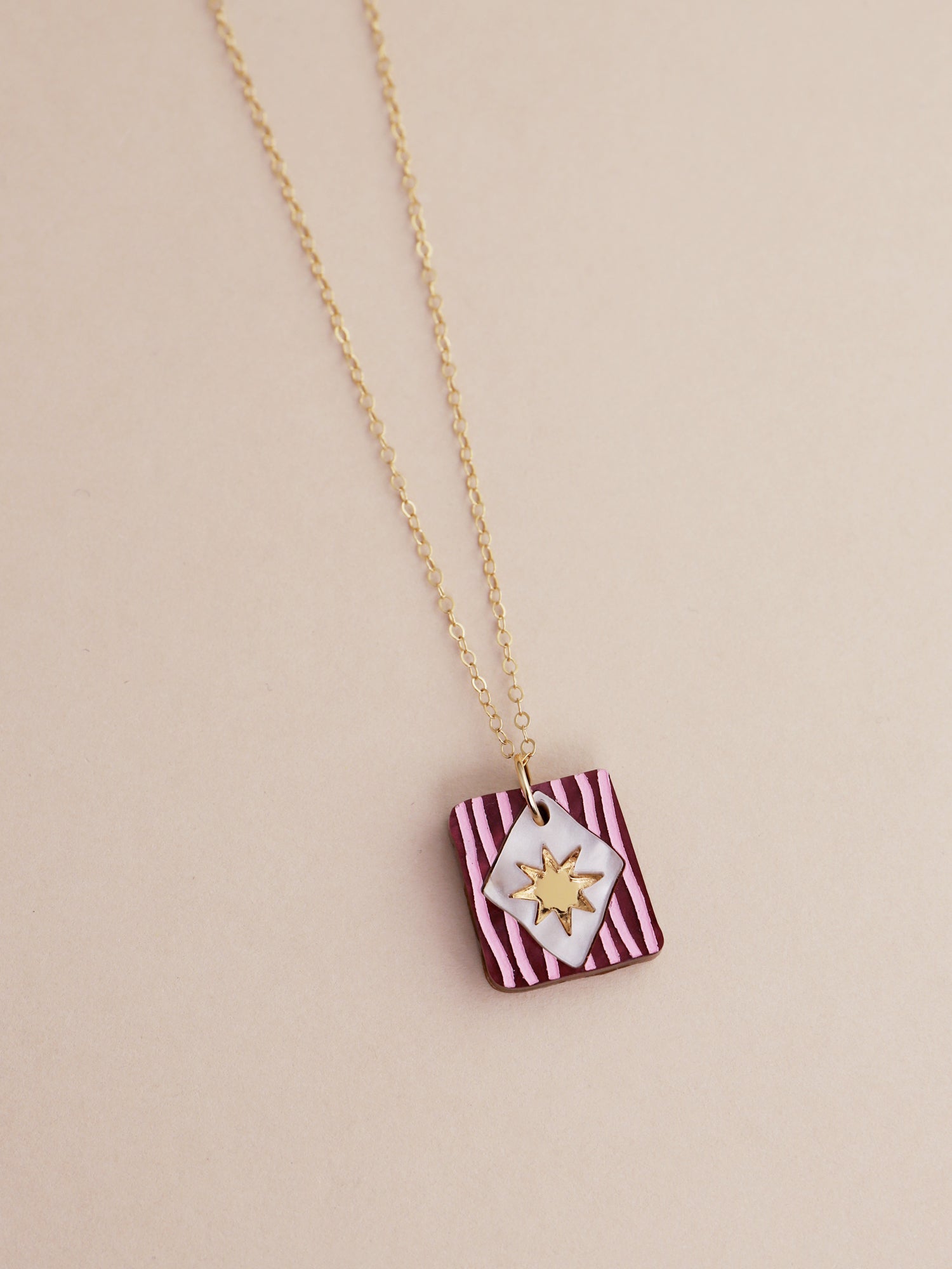 Stella Necklace in Cherry by Wolf & Moon, handmade in UK, featuring striped design and gold star charm.