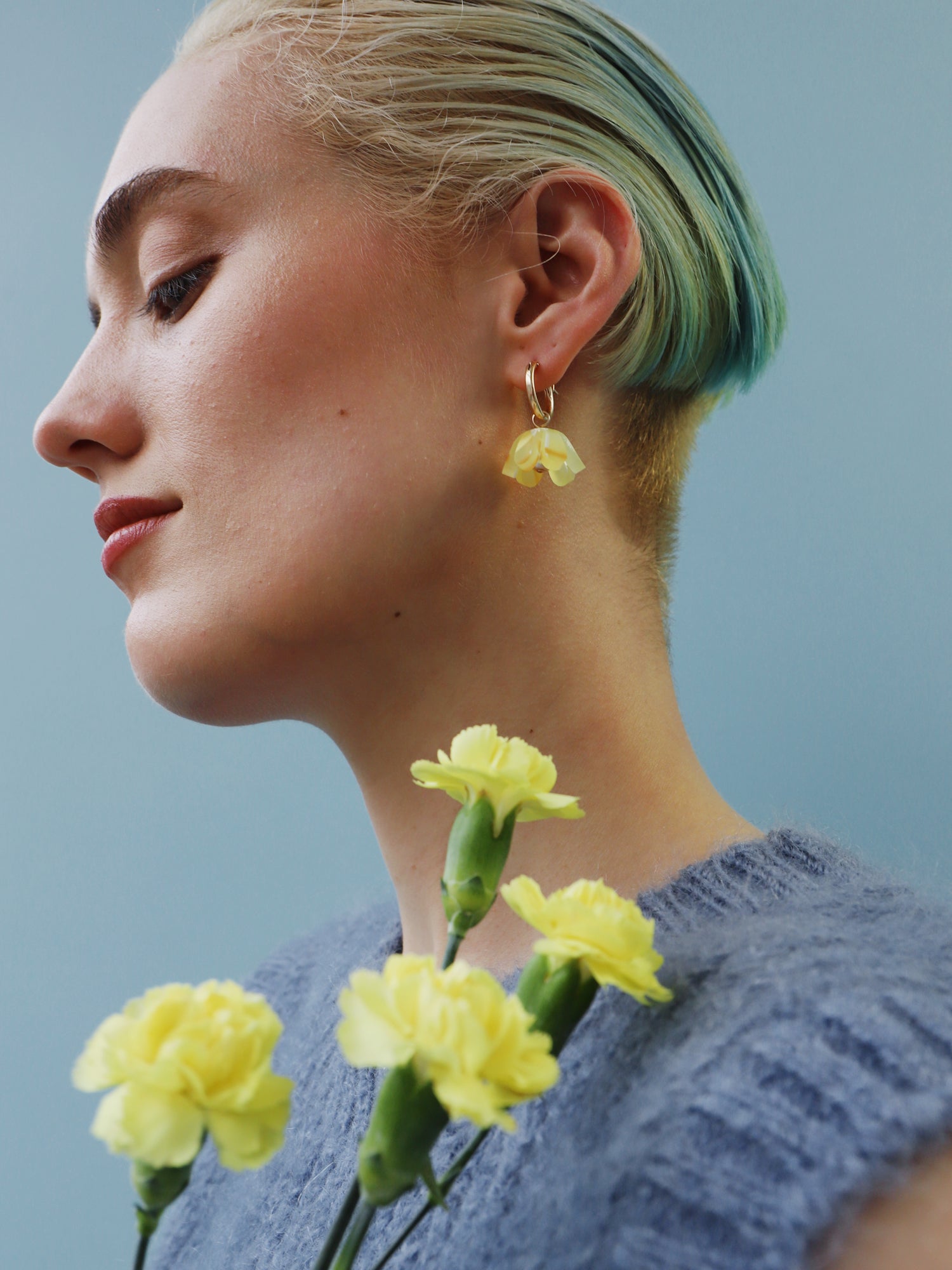 Yellow, sculptural tulip hoop earrings. Made from heat-formed acrylic with high quality glass pearls and 14k gold-filled findings. Handmade in the UK by Wolf & Moon.