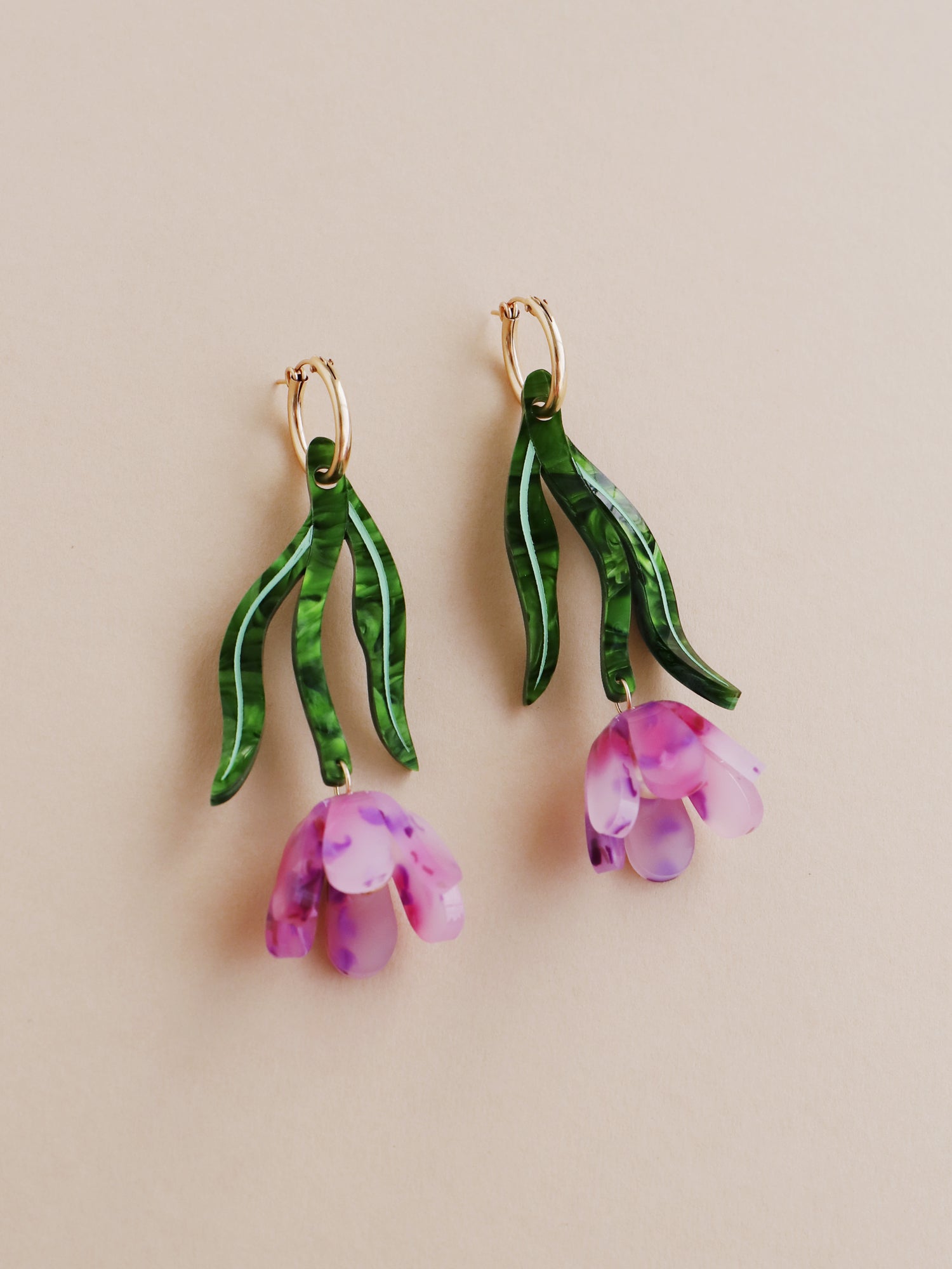 Purple & green sculptural tulip statement hoop earrings. Made from heat-formed acrylic with high quality glass pearls and 14k gold-filled findings. Handmade in the UK by Wolf & Moon.