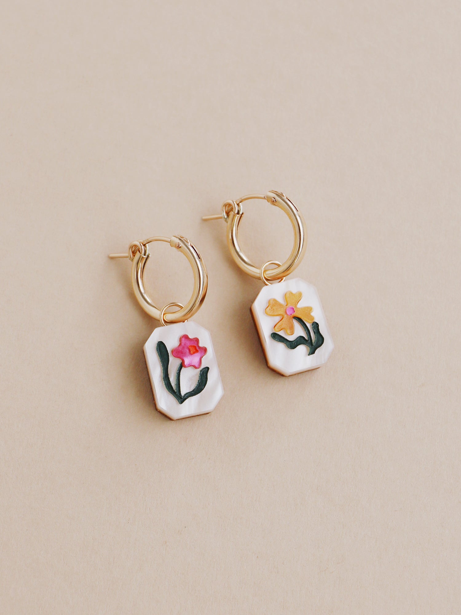Flower charm hoop earrings. Made from acrylic and 14k gold-filled hoops & findings.  Handmade in the UK by Wolf & Moon.