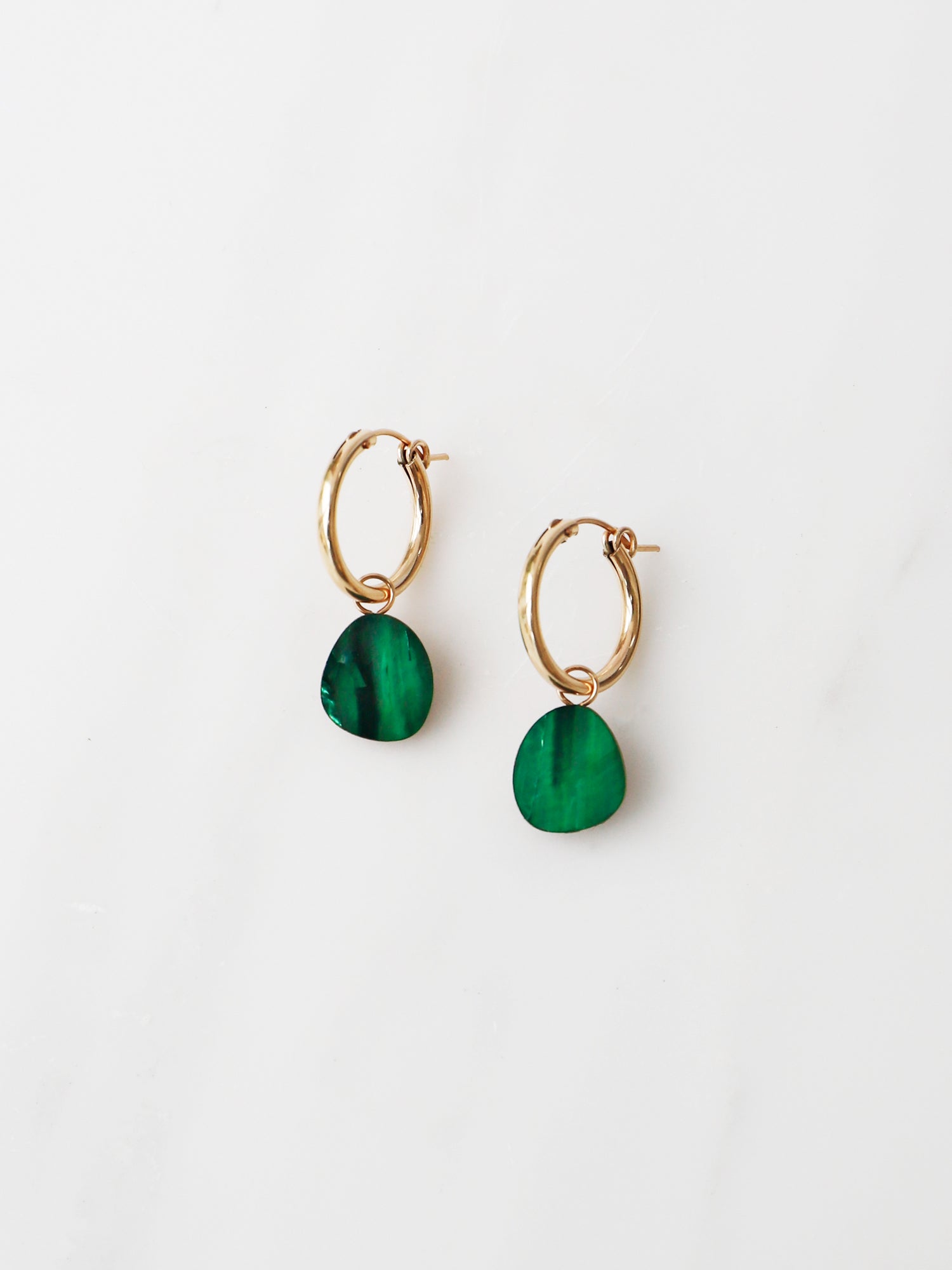 Beatrice Hoops in Emerald. Simple abstract form charm earrings. Made with emerald mother of pearl veneer on our signature wooden base and gold-filled findings. Available with 19mm gold-filled hoops or just as charms on their own. Handmade in the UK by Wolf & Moon.