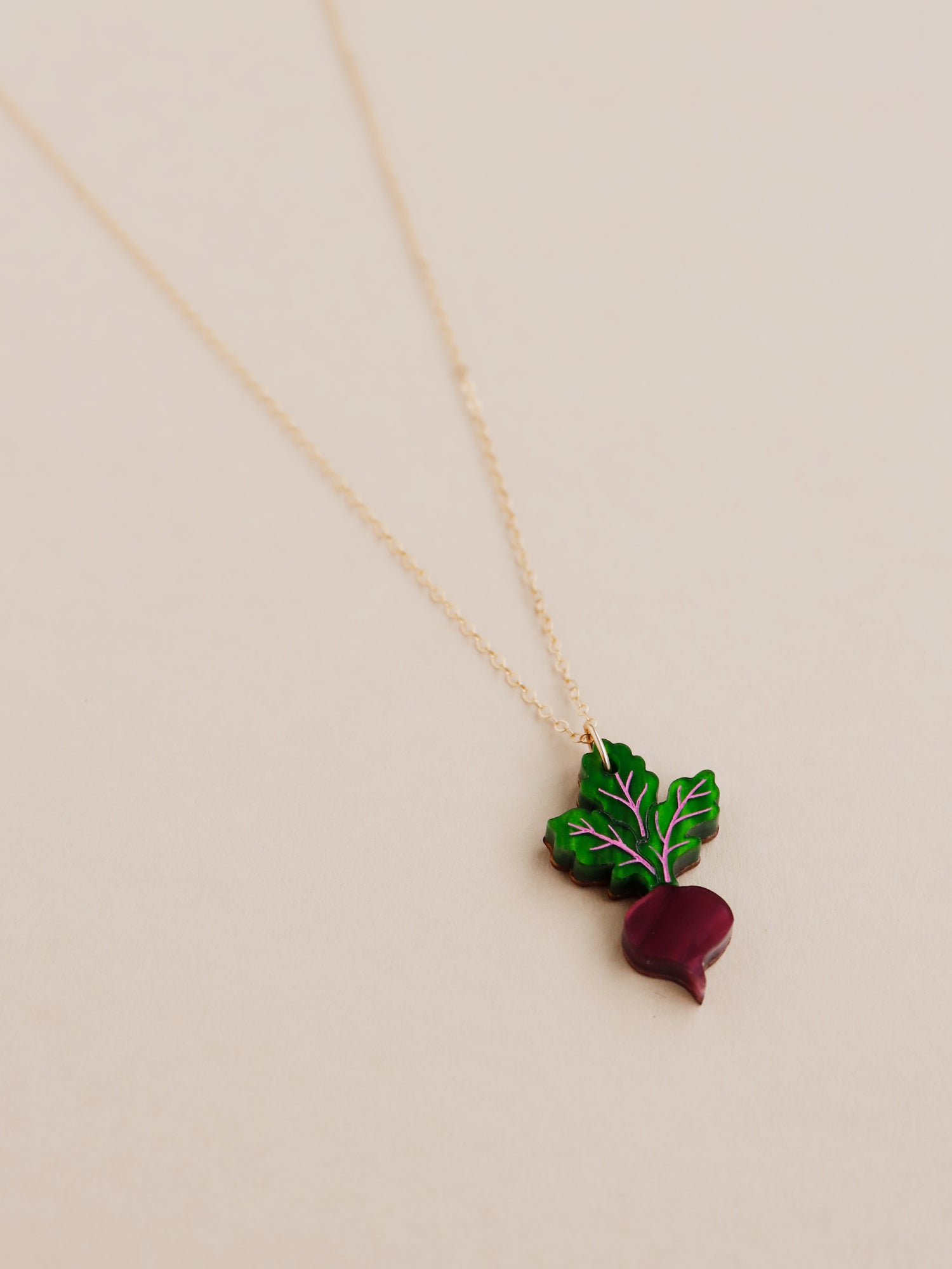 Purple and green acrylic mini beetroot pendant necklace with optional gold-filled chain. Handmade in London by Wolf & Moon.