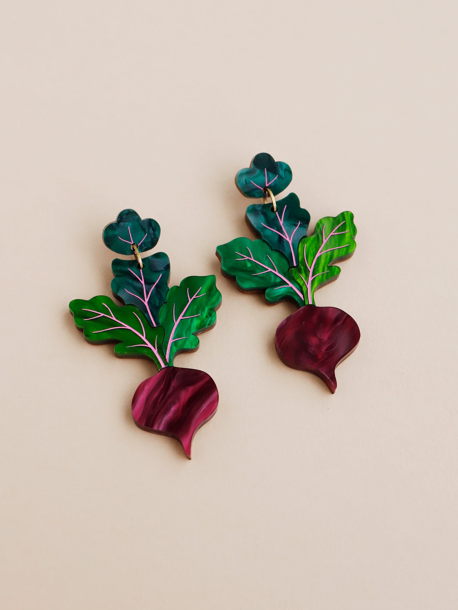Purple and green hand-inked statement beetroot earrings. Handmade in London by Wolf & Moon.