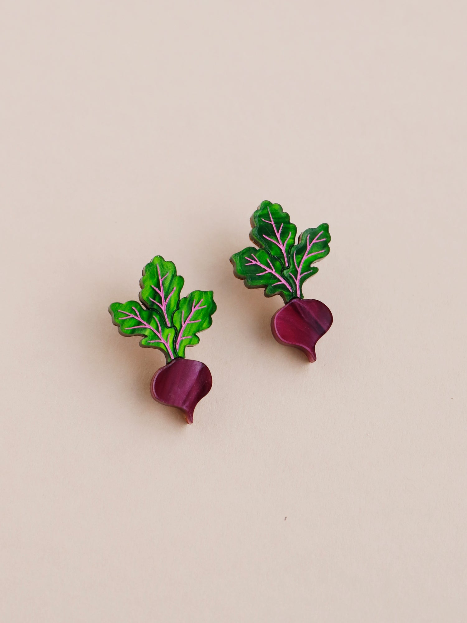 Purple and green acrylic beetroot mini stud clip-on earrings. Handmade in London by Wolf & Moon.