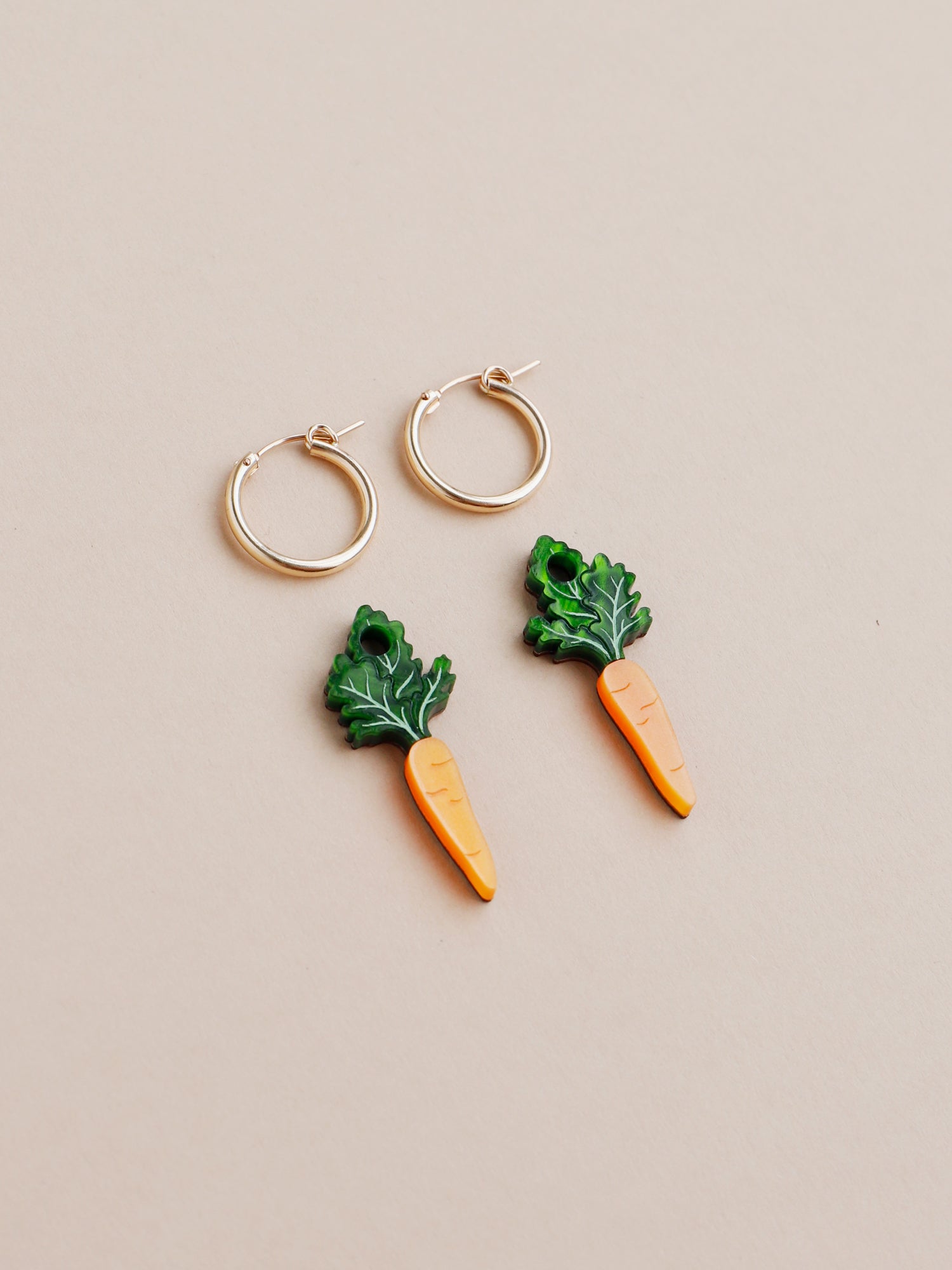 Orange and green carrot charm acrylic earrings with optional gold-filled hoops. Handmade in London by Wolf & Moon.