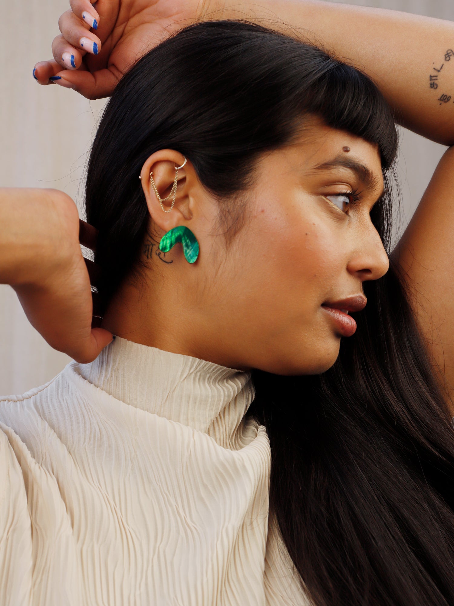 Cassia Studs in Emerald. Sophisticated everyday studs made with FSC approved wood and emerald tone mother of pearl. Made in the UK by Wolf & Moon.