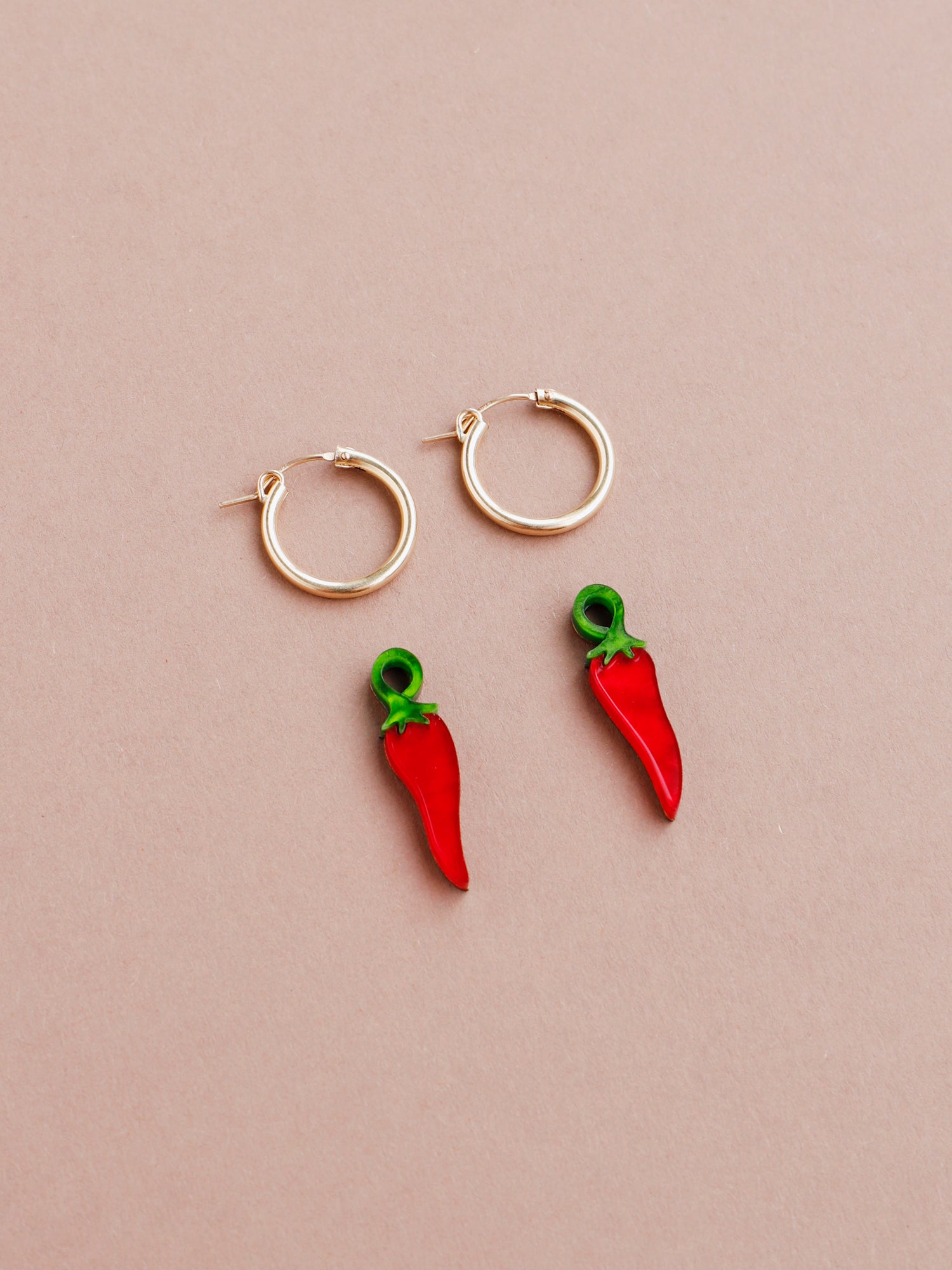 Red chilli pepper acrylic charms with optional gold-filled hoops. Handmade in London by Wolf & Moon.