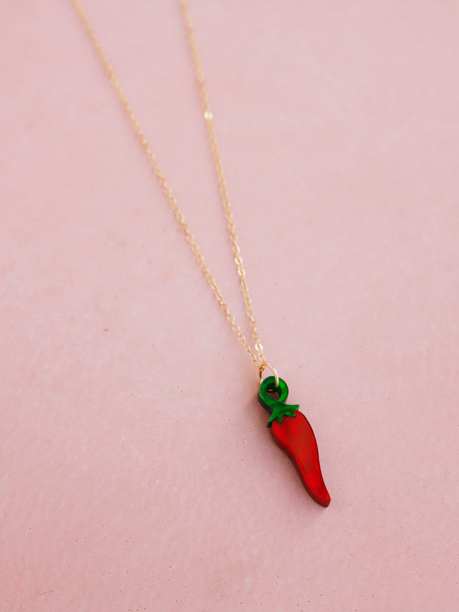 Red acrylic chilli pepper necklace with optional gold-filled chain. Handmade in London by Wolf & Moon.