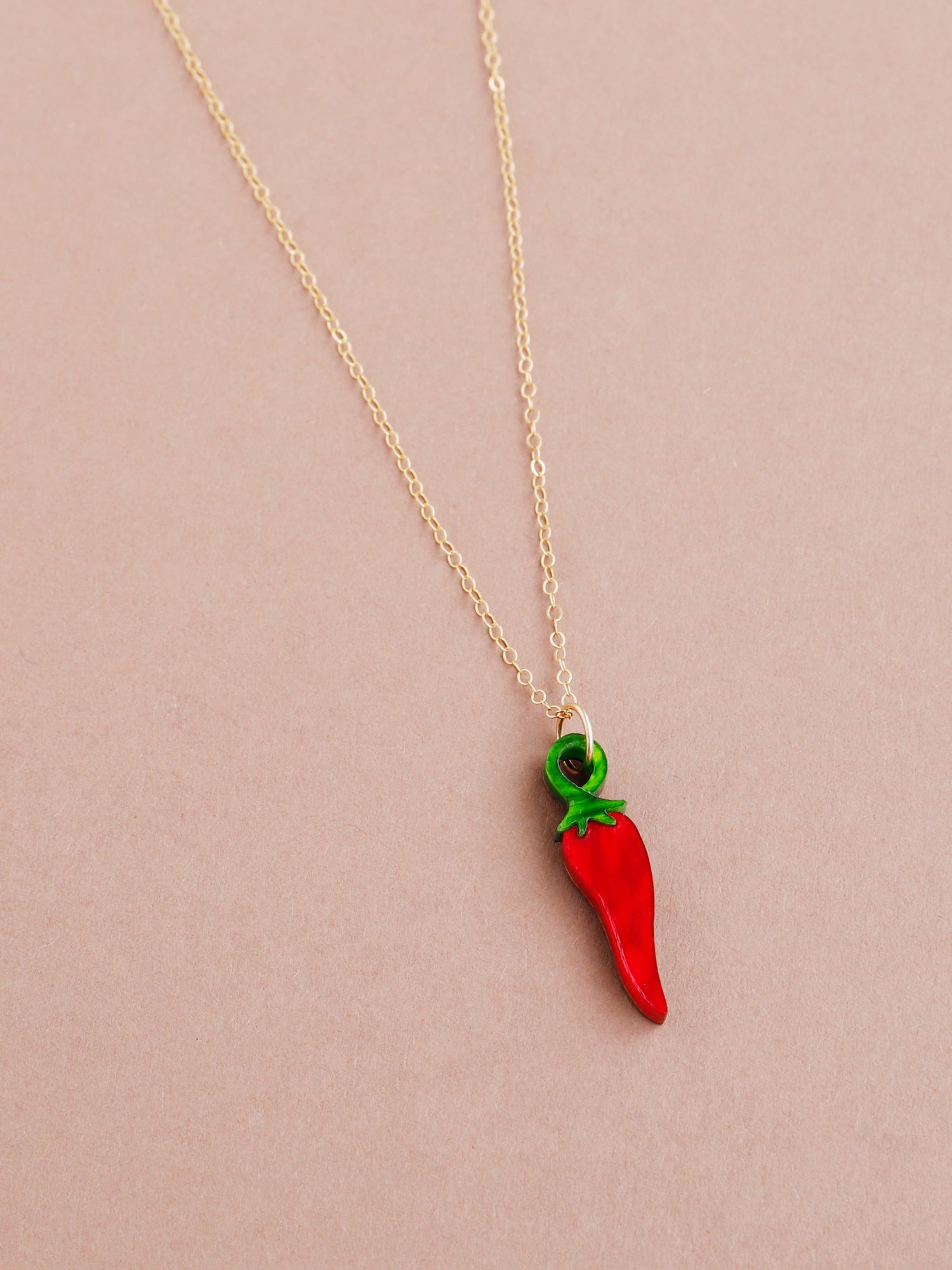 Red acrylic chilli pepper necklace with optional gold-filled chain. Handmade in London by Wolf & Moon.