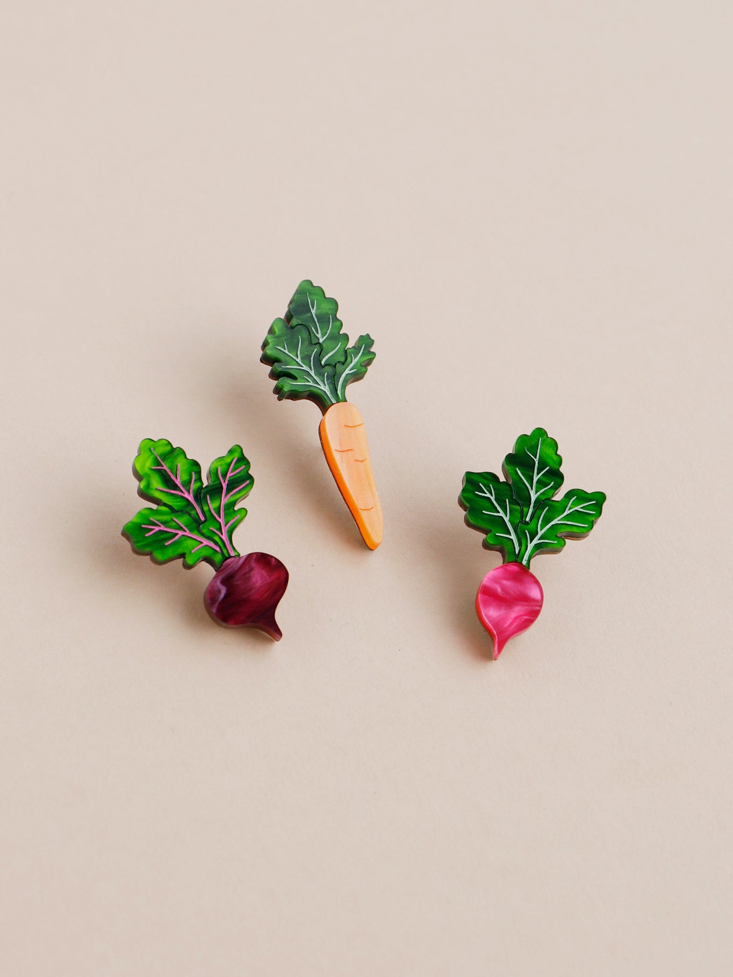 Pin set including our mini carrot, beetroot and radish vegetables. Made with acrylic and our FSC approved wood backing.   1 x silver tone brooch pin & locking clasps. Handmade in London by Wolf & Moon.