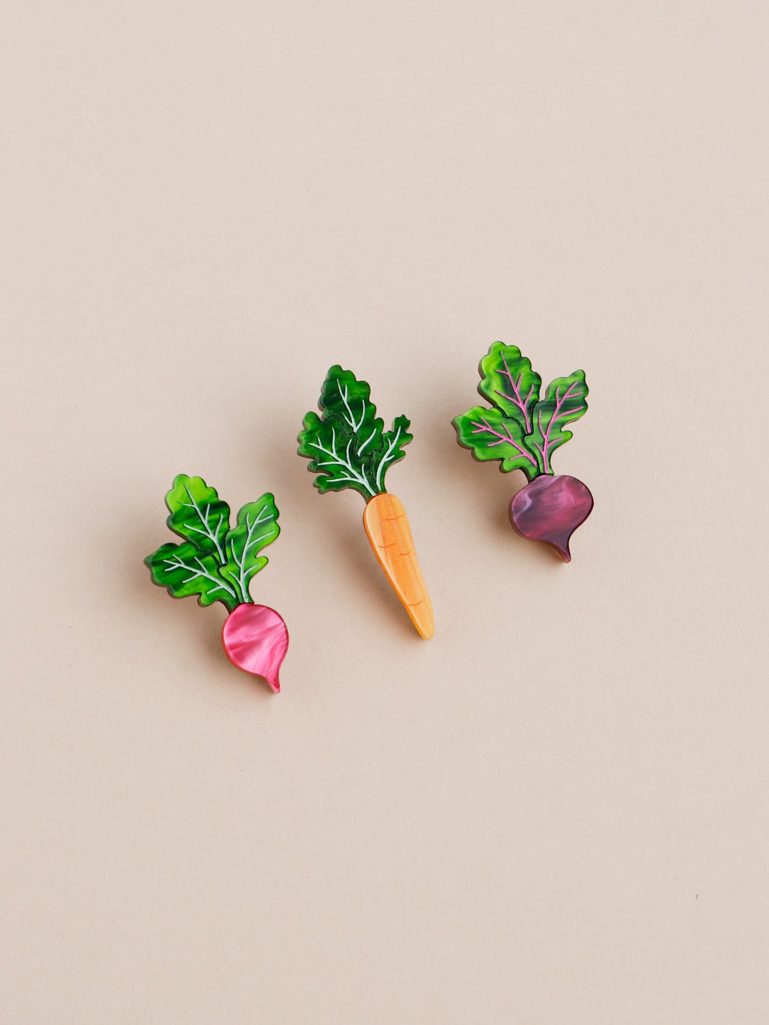 Pin set including our mini carrot, beetroot and radish vegetables. Made with acrylic and our FSC approved wood backing. 1 x silver tone brooch pin & locking clasps. Handmade in London by Wolf & Moon.