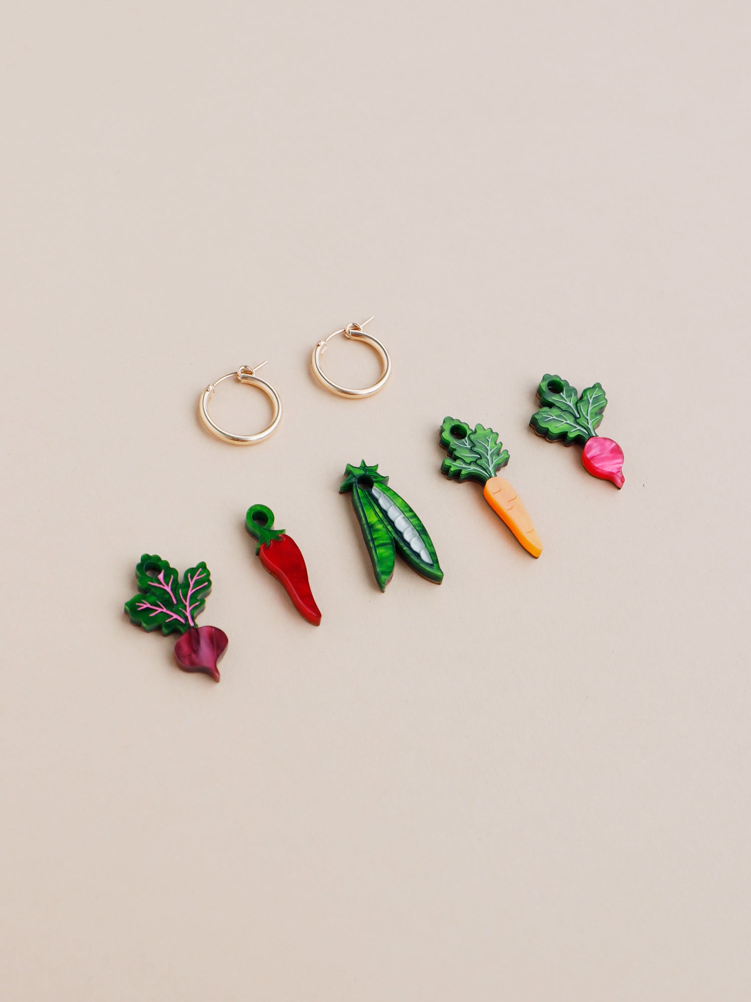 Our Five A Day set includes 1x Radish charm, 1 x Chilli Pepper charm , 1 x Carrot charm , 1 x Peas in a Pod charm, 1 x Beetroot charm. Charms that can be purchased with our gold-filled hoops. Handmade in London by Wolf & Moon.
