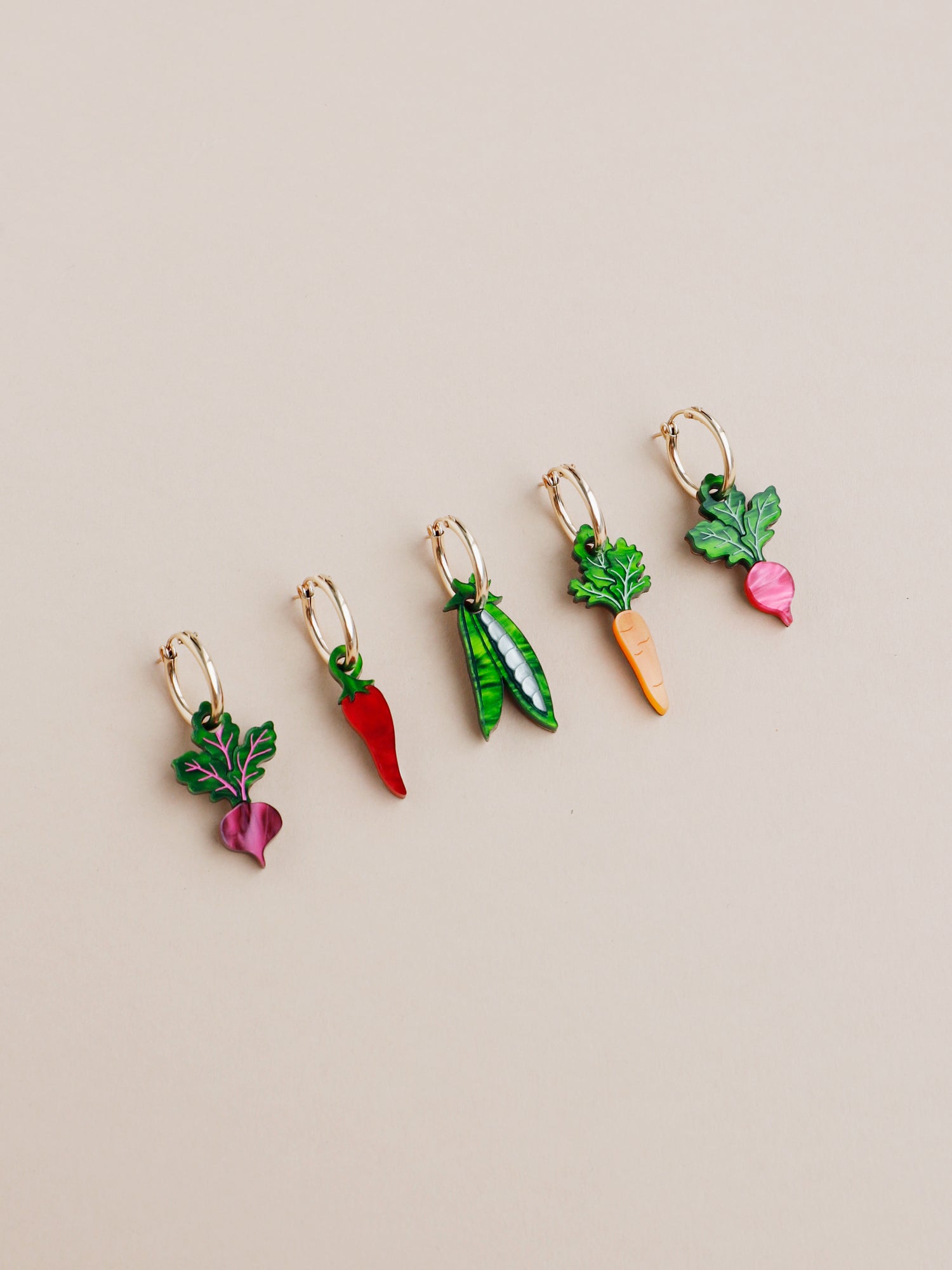 Our Five A Day set includes 1x Radish charm, 1 x Chilli Pepper charm , 1 x Carrot charm , 1 x Peas in a Pod charm, 1 x Beetroot charm. Charms that can be purchased with our gold-filled hoops. Handmade in London by Wolf & Moon.