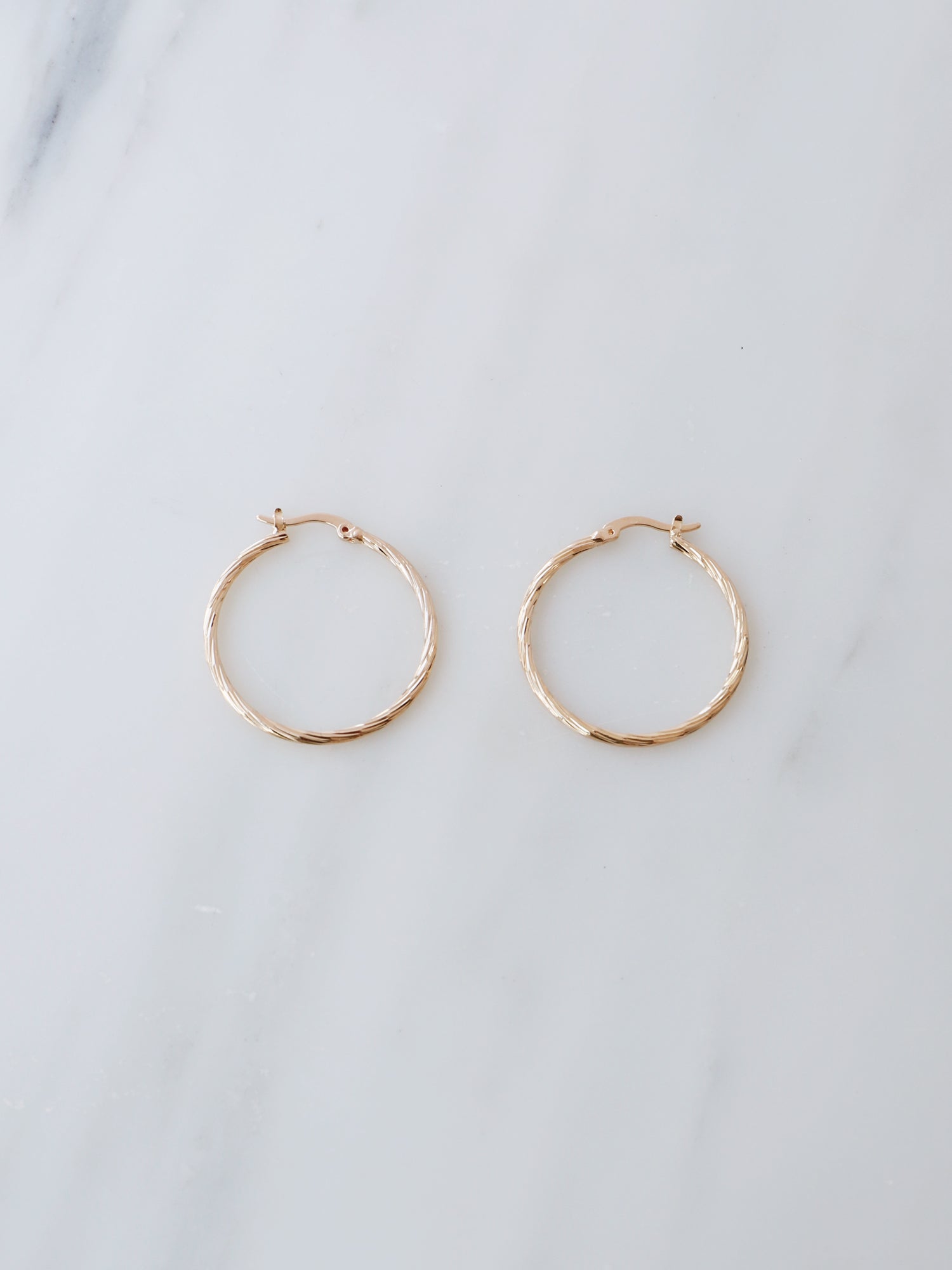 30mm hoops are made from solid brass with a very high quality 3-micron 24k gold-plating. Handmade in France, available from Wolf & Moon. 
