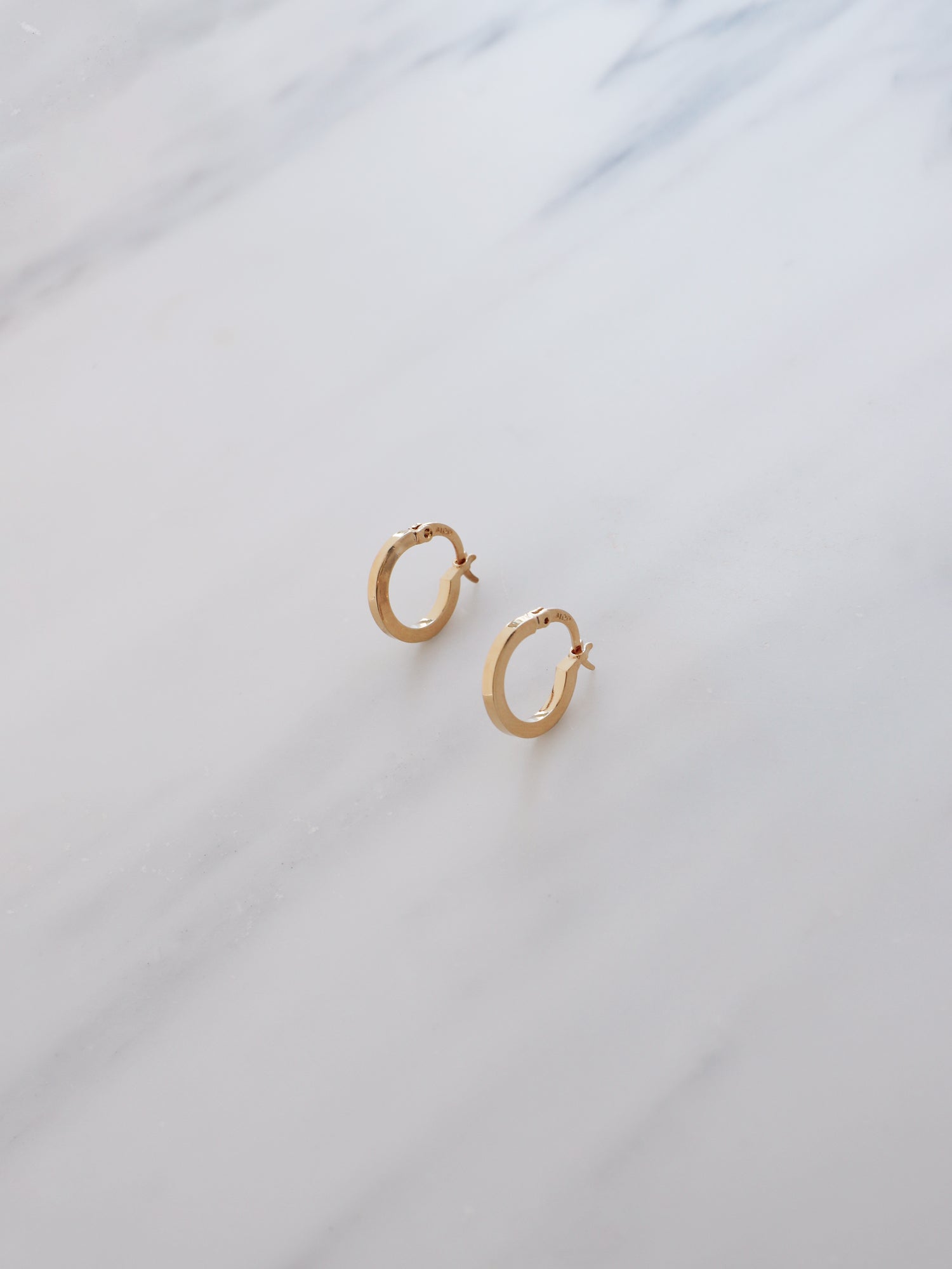 15mm hoops are made from solid brass with a very high quality 3-micron 24k gold-plating. Handmade in France, available from Wolf & Moon. 