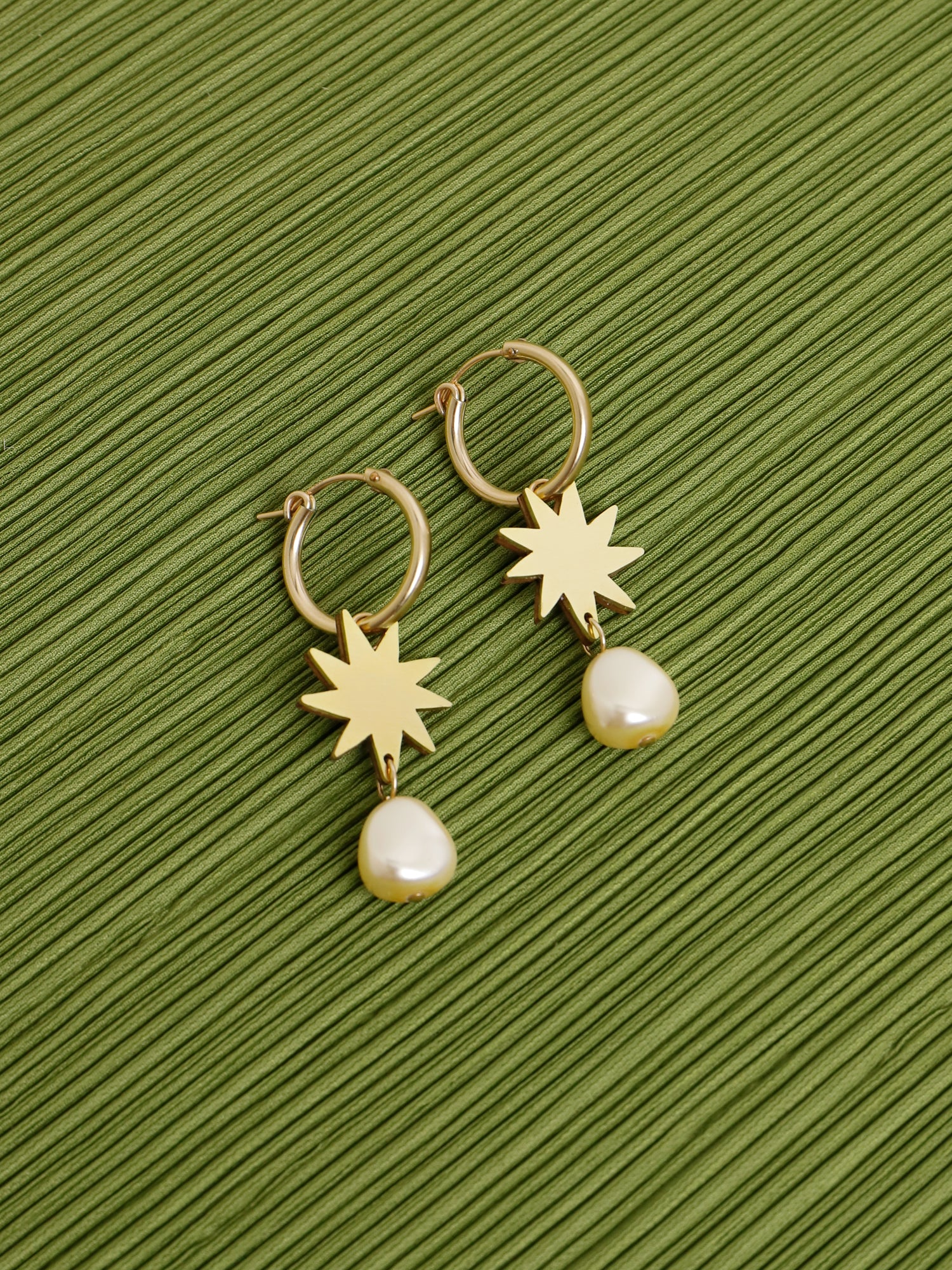 Elegant hoop earrings, inspired by Matisse's cutout-style stars. Made in brass with our signature wood base, Czech glass baroque pearls and 14k gold-filled findings. Handmade in the UK by Wolf & Moon.
