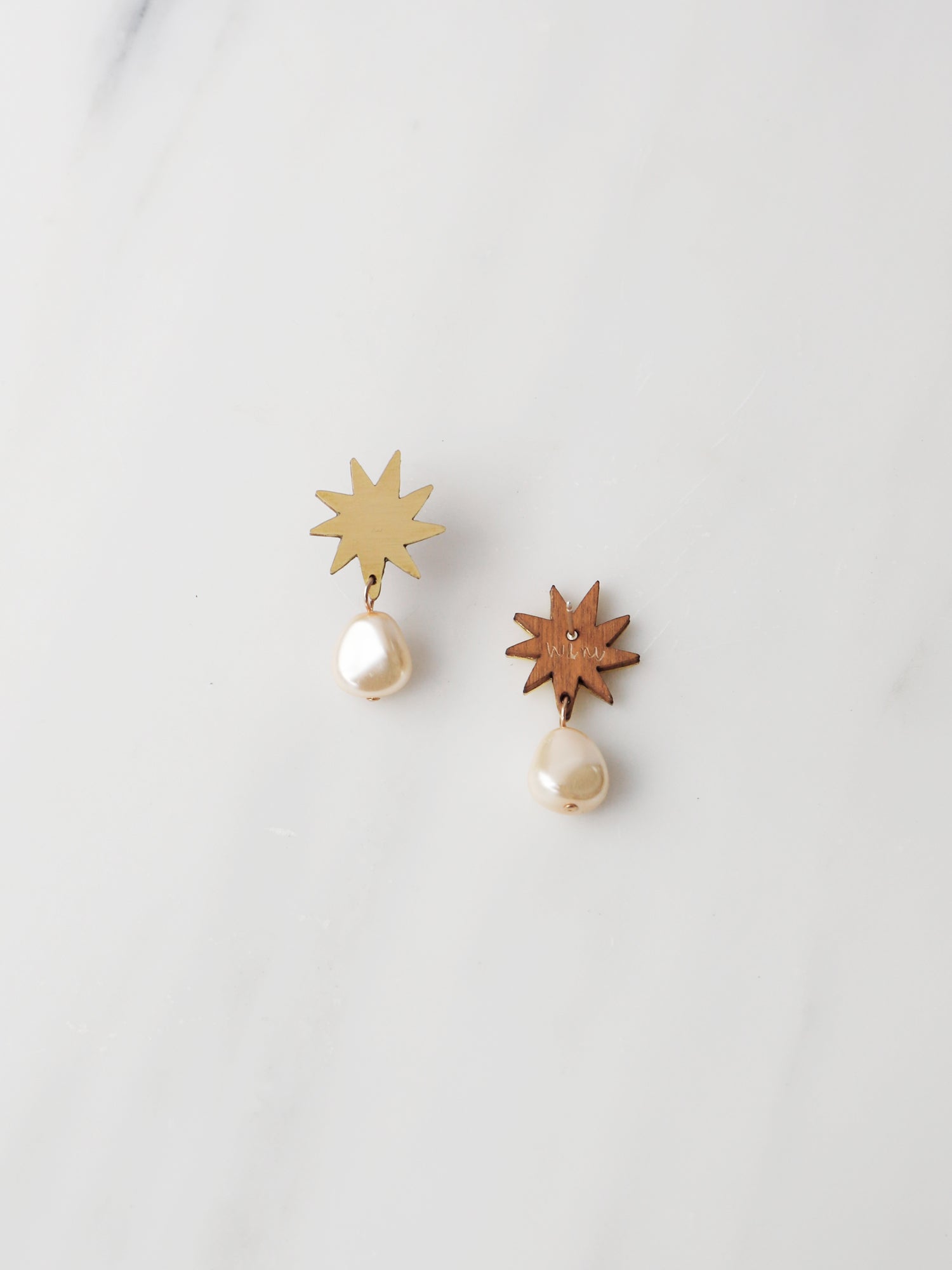 Playful pendant, inspired by Matisse's cutout-style stars. Made in brass with our signature wood base, Czech glass baroque pearl and 14k gold-filled chain. Handmade in the UK by Wolf & Moon.