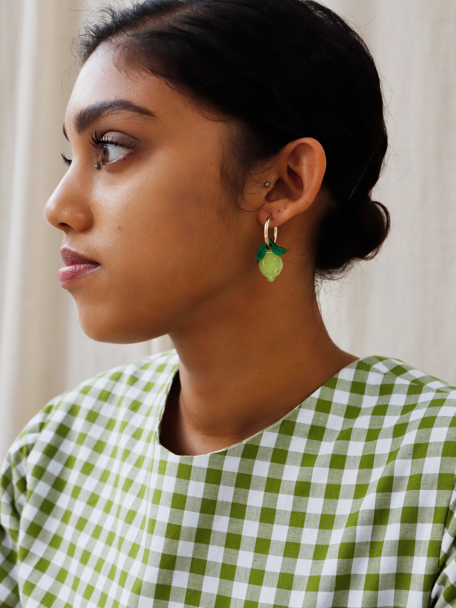 Lime hoops made with wood, 64% recycled acrylic and hand-inked details with sterling silver earring posts & butterflies. Handmade in the UK at Wolf & Moon.