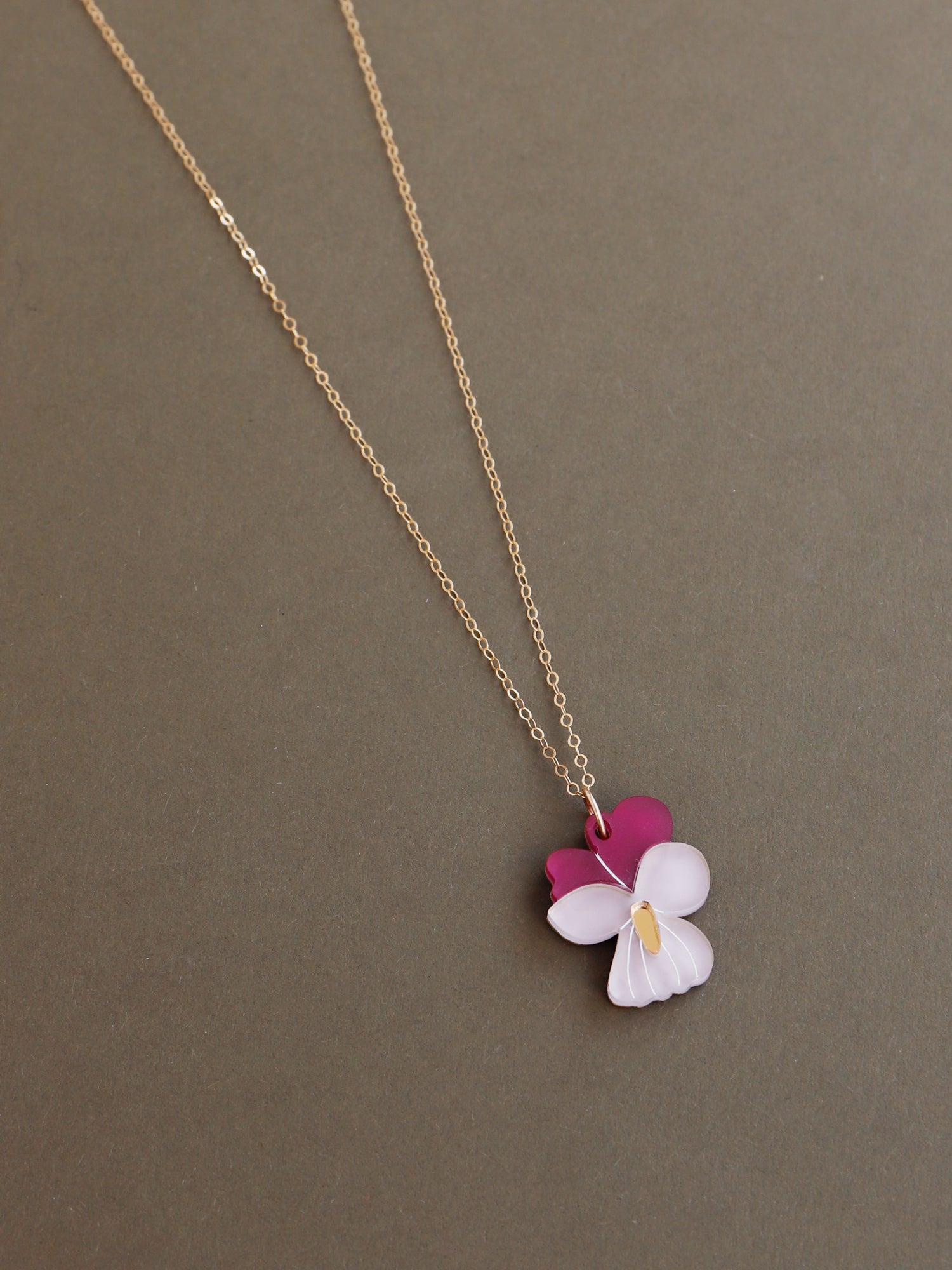 Illustrated violet flower pendant made with wood, 64% recycled acrylic and hand-inked details with 45cm 14k gold-filled chain and findings. Handmade in the UK by Wolf & Moon.