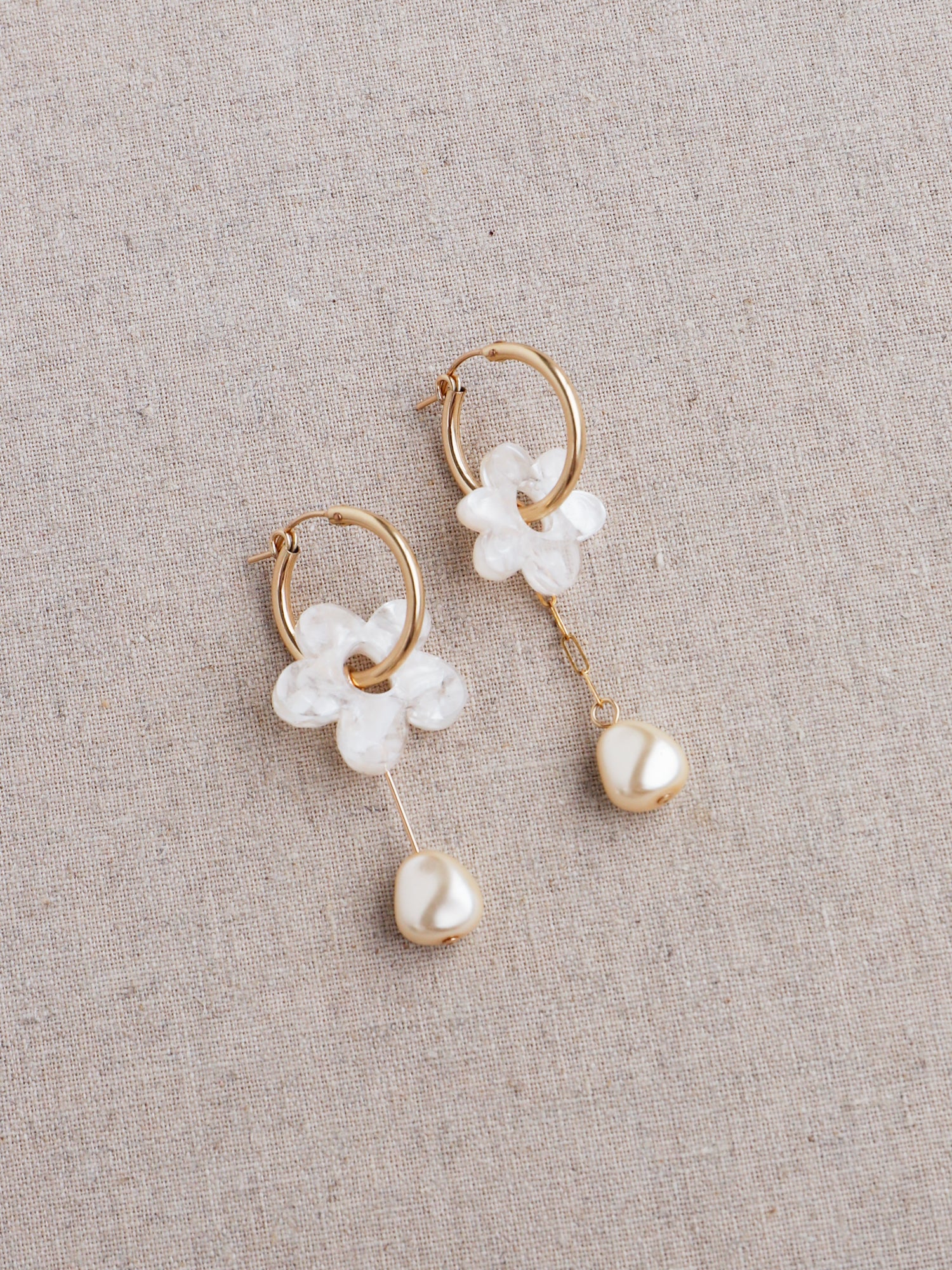 Nina Charm Hoops in Off-White. 4 individual charms made using 100% recycled, semi-transparent, off-white acrylic with a brushed matt finish and faux pearls. Handmade in the UK by Wolf & Moon. 