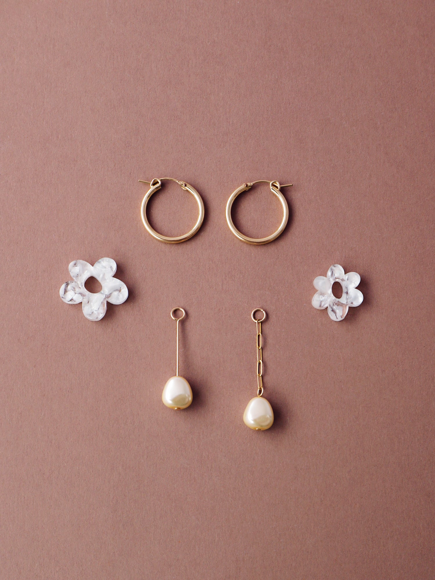Nina Charm Hoops in Off-White. 4 individual charms made using 100% recycled, semi-transparent, off-white acrylic with a brushed matt finish and faux pearls. Handmade in the UK by Wolf & Moon. 
