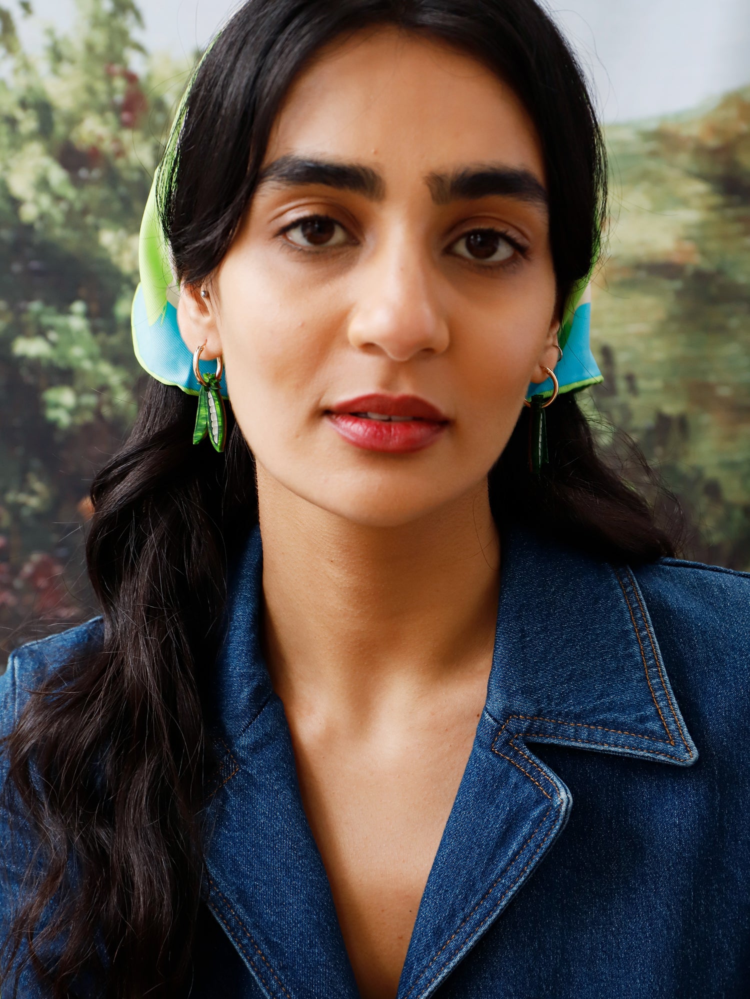 These playful peas in a pod hoop earrings are made from marbled acrylic, wood with sterling silver posts. Handmade in London by Wolf & Moon.