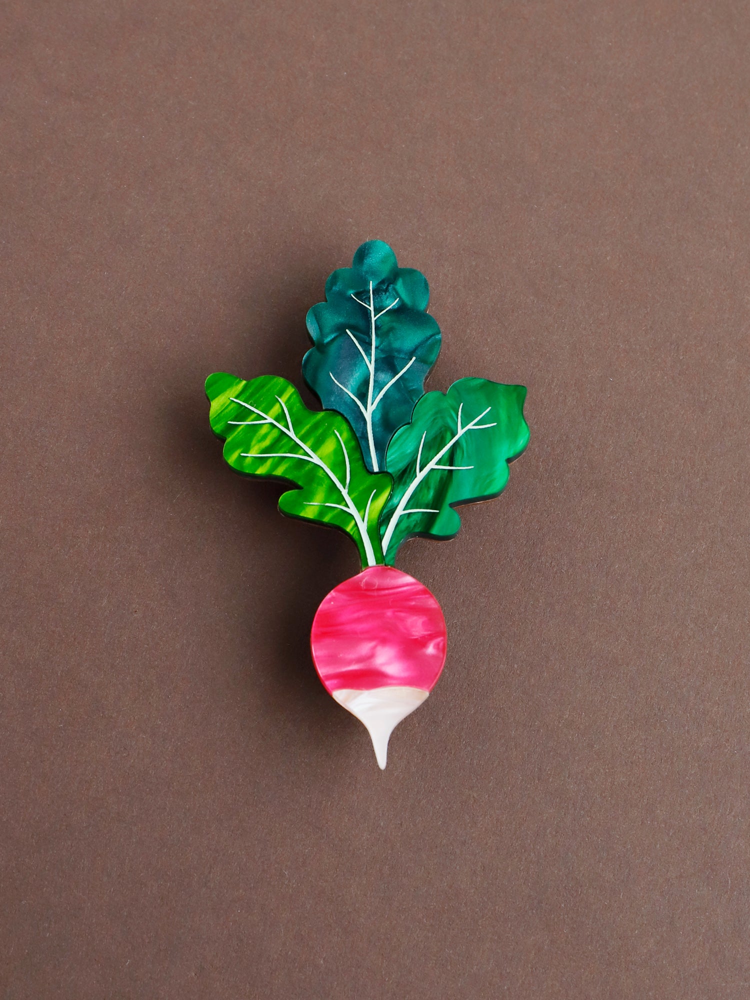Pink and green statement acrylic radish brooch. Handmade in London by Wolf & Moon.