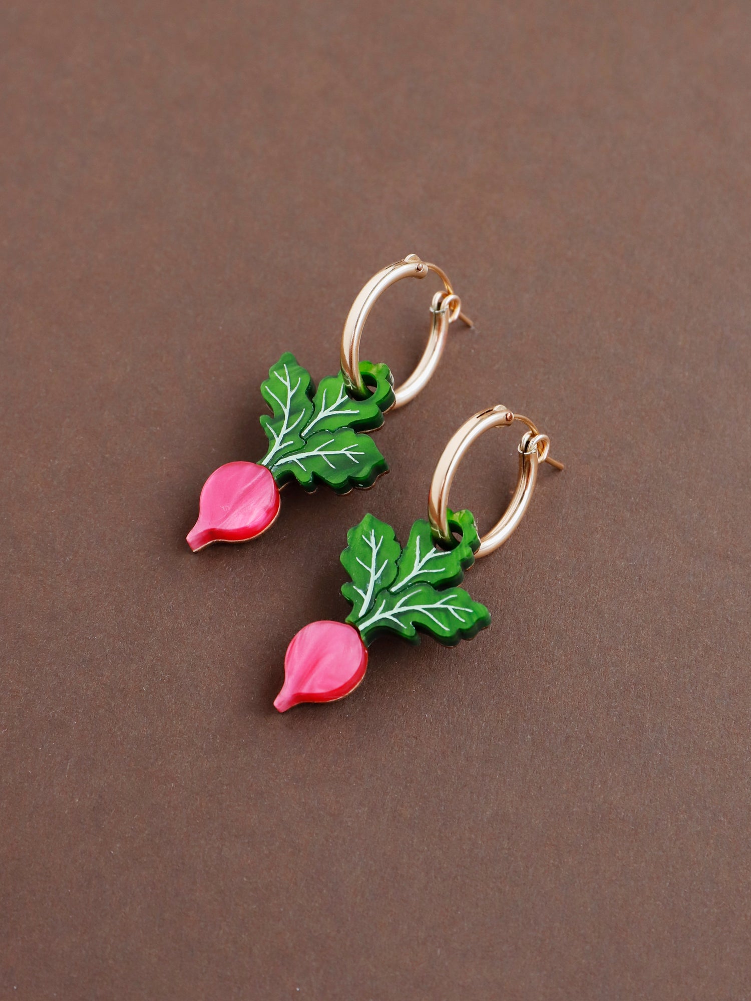 Pink and green acrylic mini radish charm earrings with optional gold-filled hoops. Handmade in London by Wolf & Moon.
