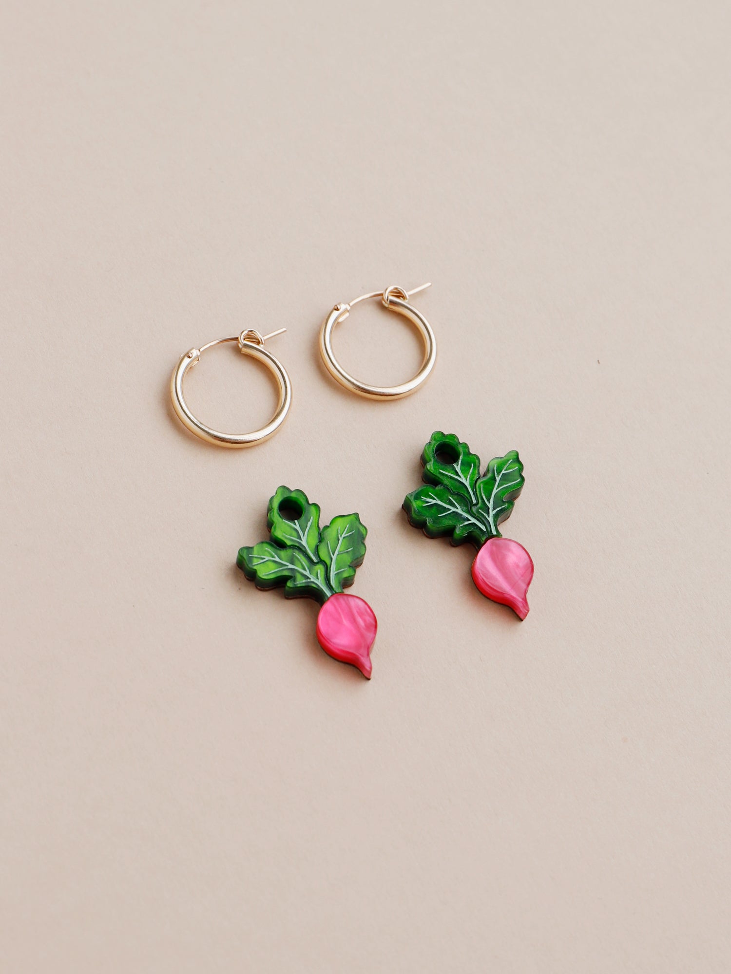 Pink and green acrylic mini radish charm earrings with optional gold-filled hoops. Handmade in London by Wolf & Moon.