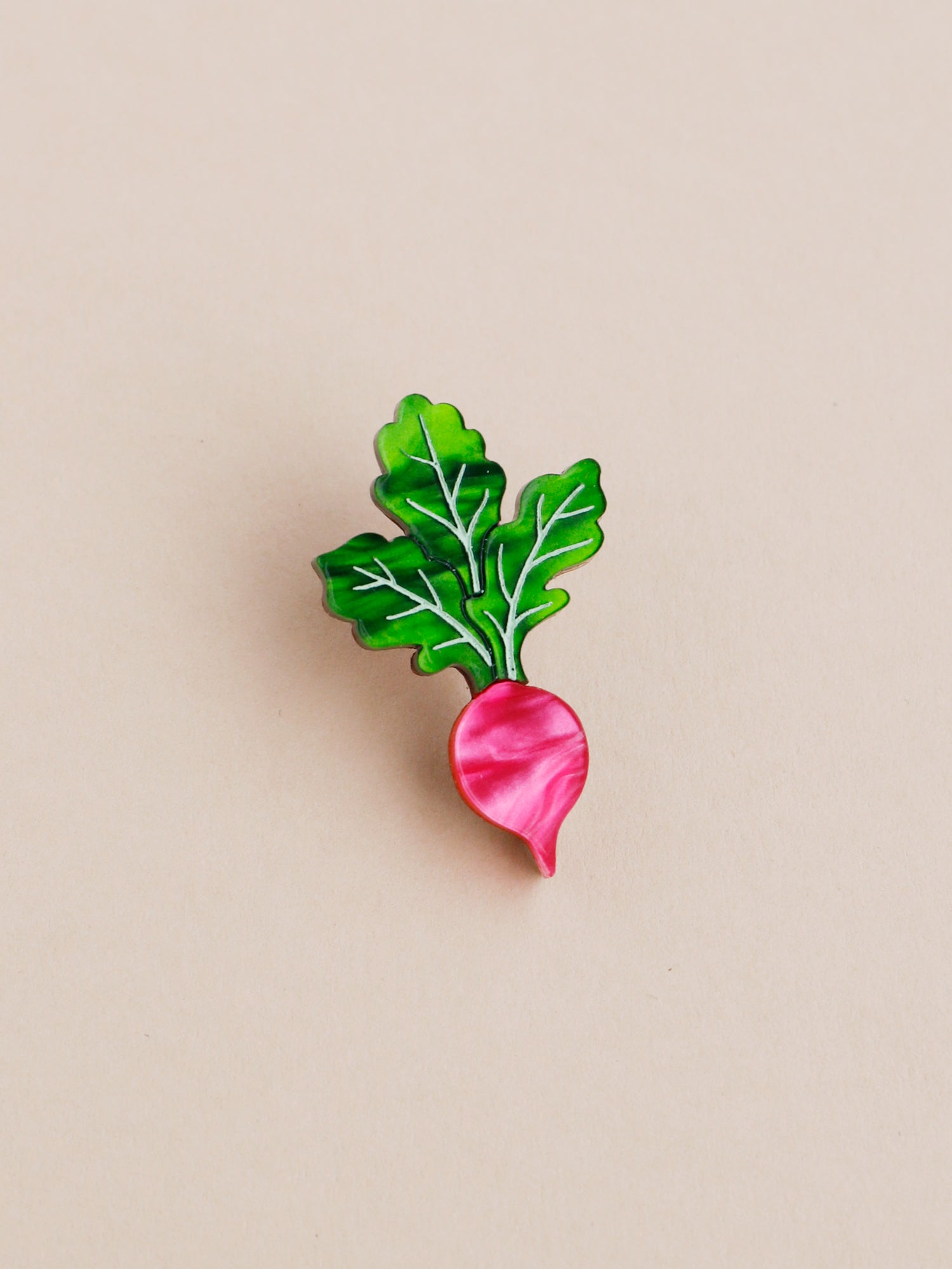 Pink and green acrylic radish mini pin. Handmade in London by Wolf & Moon.