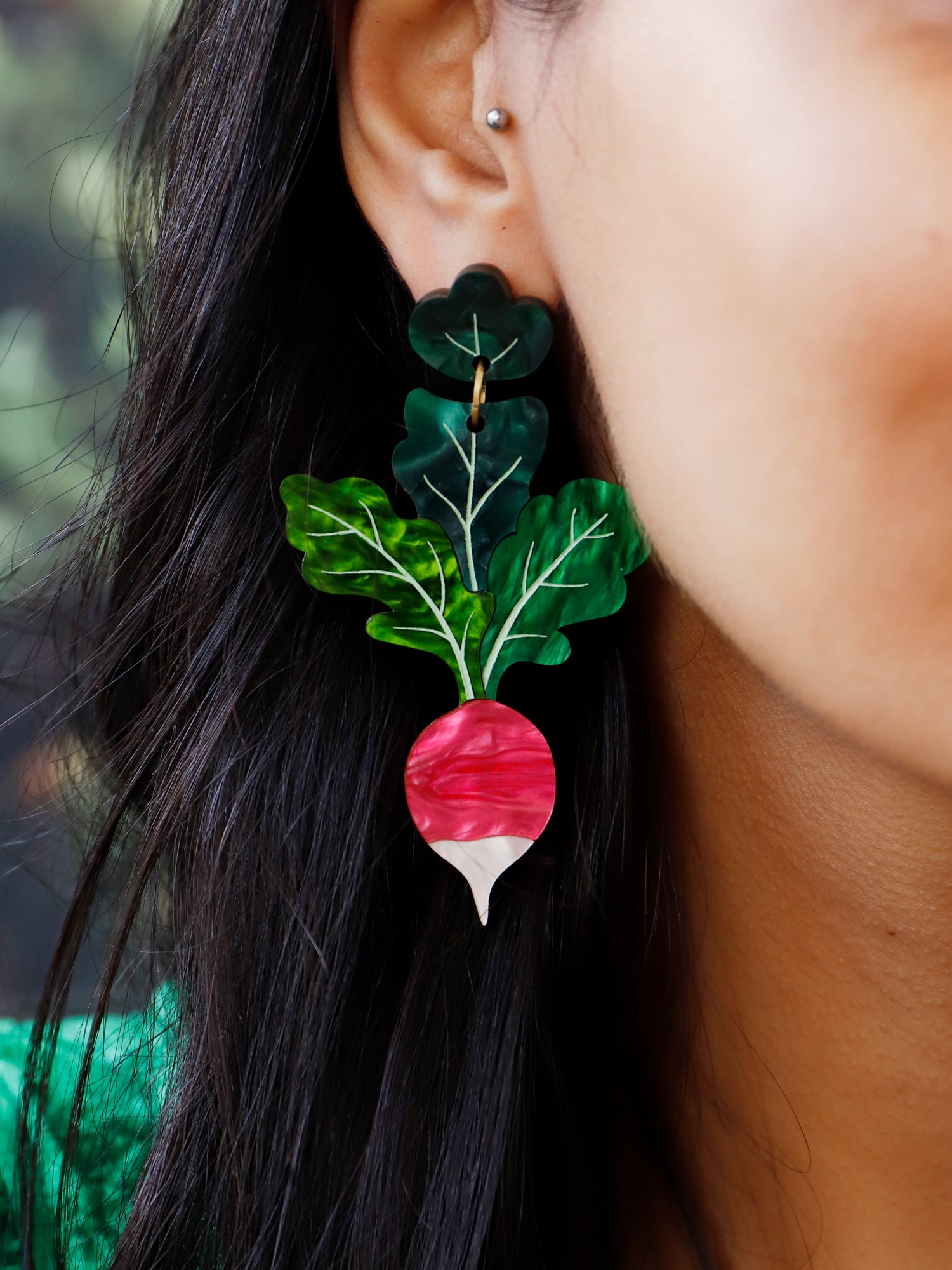 Statement red and green radish acrylic earrings. Handmade in London by Wolf & Moon.